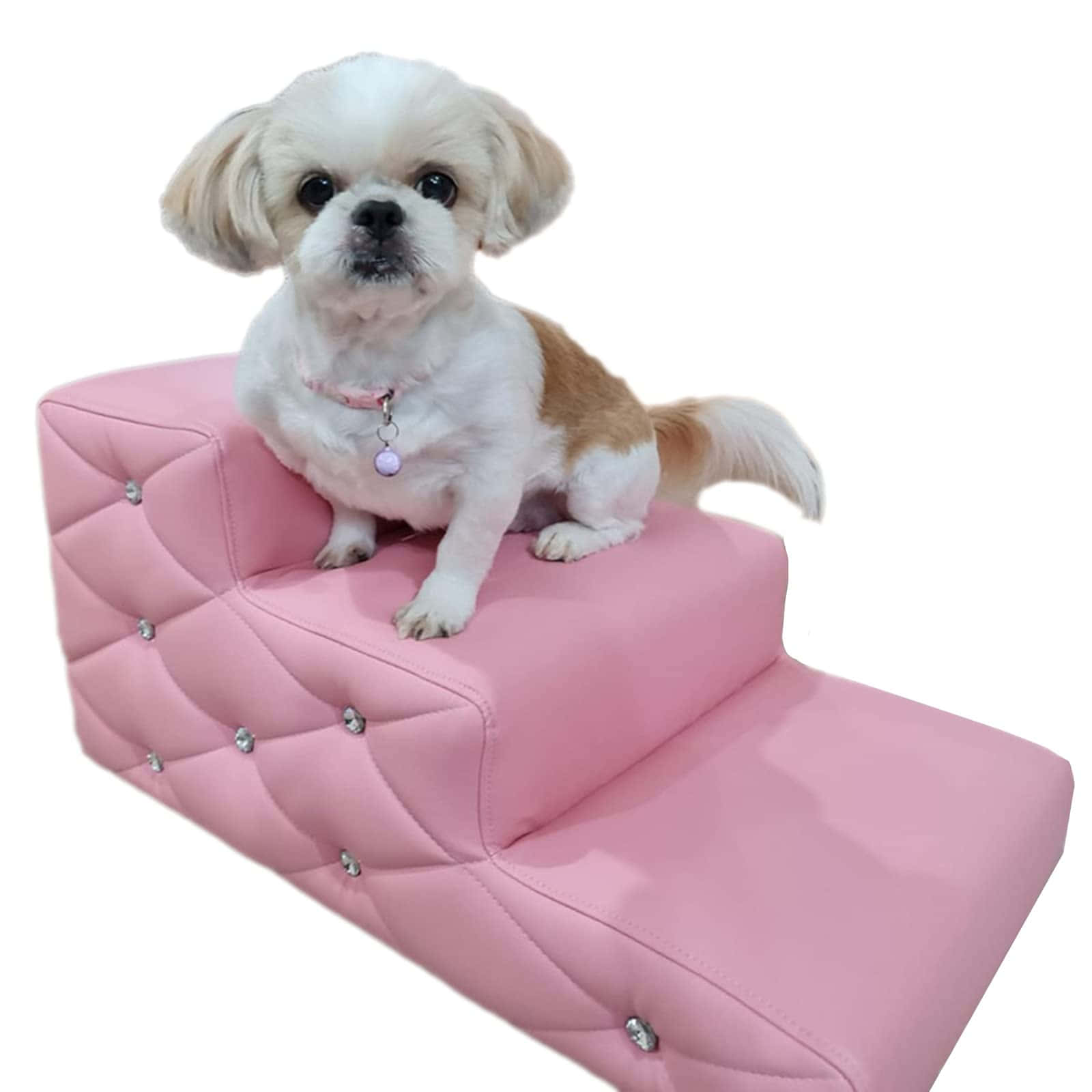 A Small Dog Sitting On A Pink Padded Step Stool