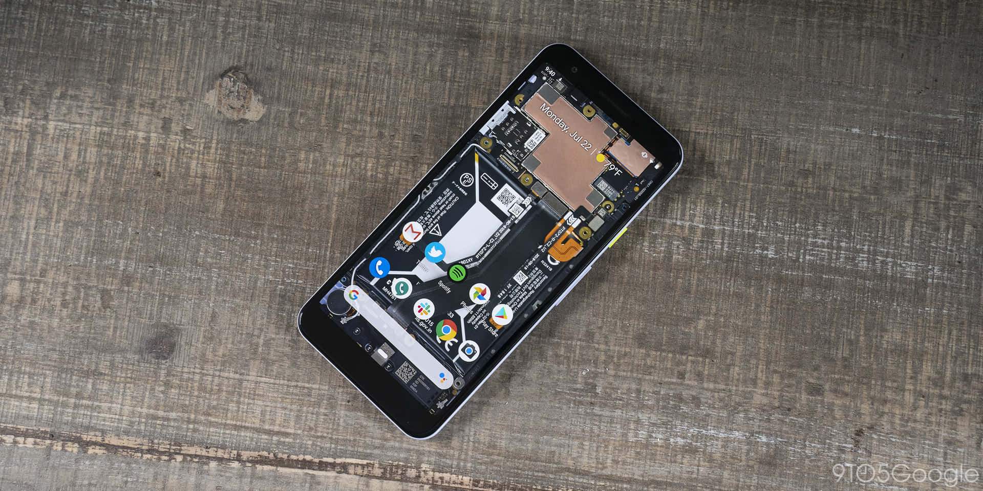 A Smartphone Is Sitting On A Wooden Table Background