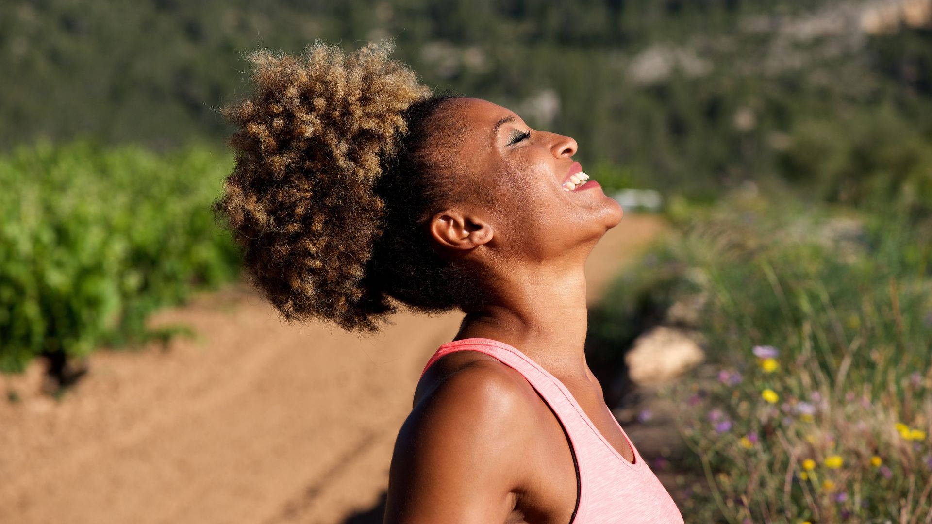 A Smiling African Woman Enjoying A Healthy Workout