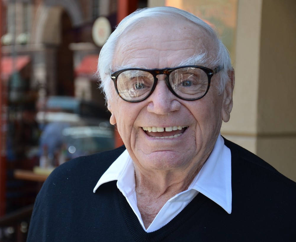 A Smiling Ernest Borgnine In Eyeglasses Background