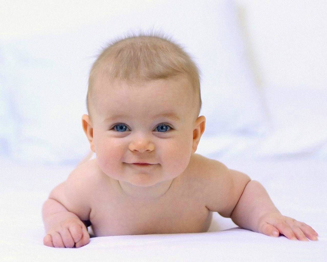 A Smiling Newborn Baby