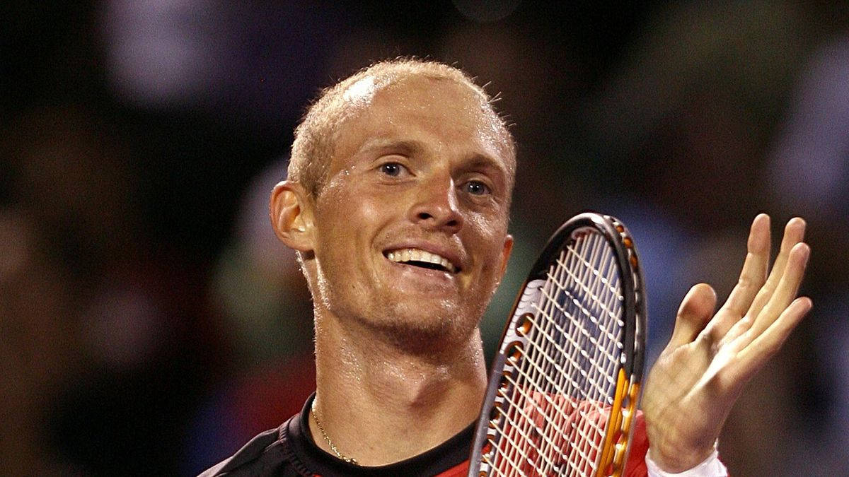 A Smiling Nikolay Davydenko During A Tennis Match Background