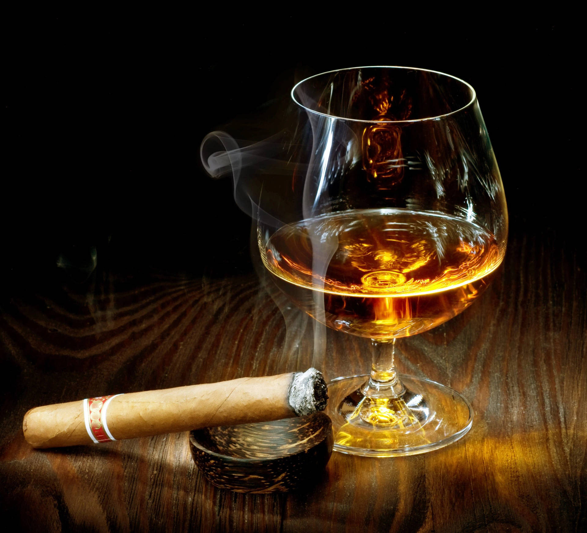 A Smooth Brandy Experience - Pairing Drink With Tobacco Background