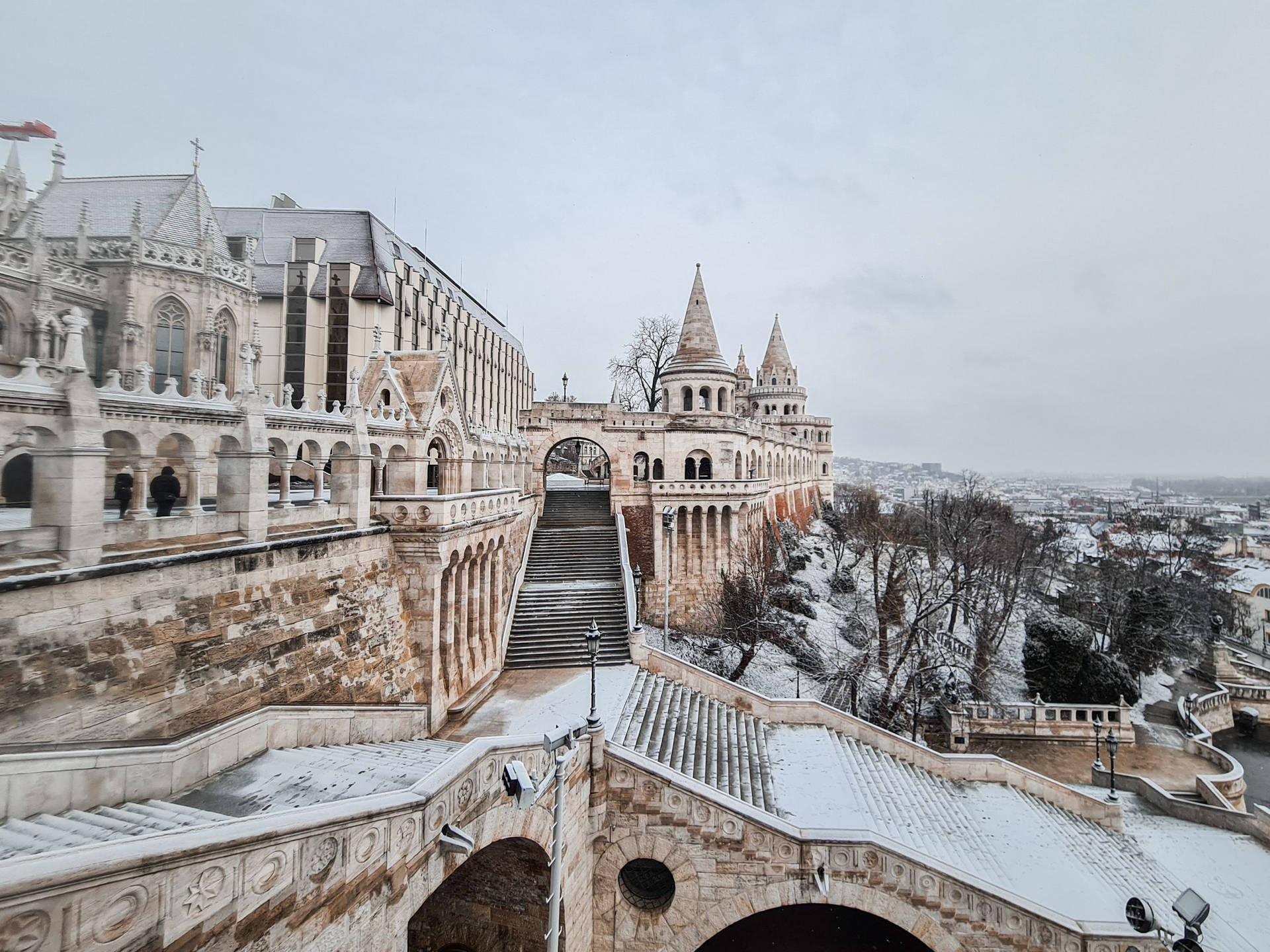 A Snow Covered Castle With A Snow Covered Walkway