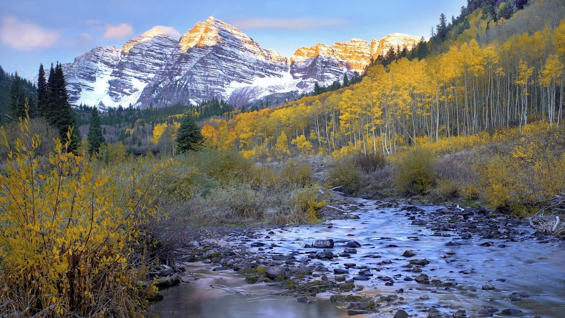 A Snow-covered Mountain Peak Seen Under A Clear Blue Sky, Colorado Background