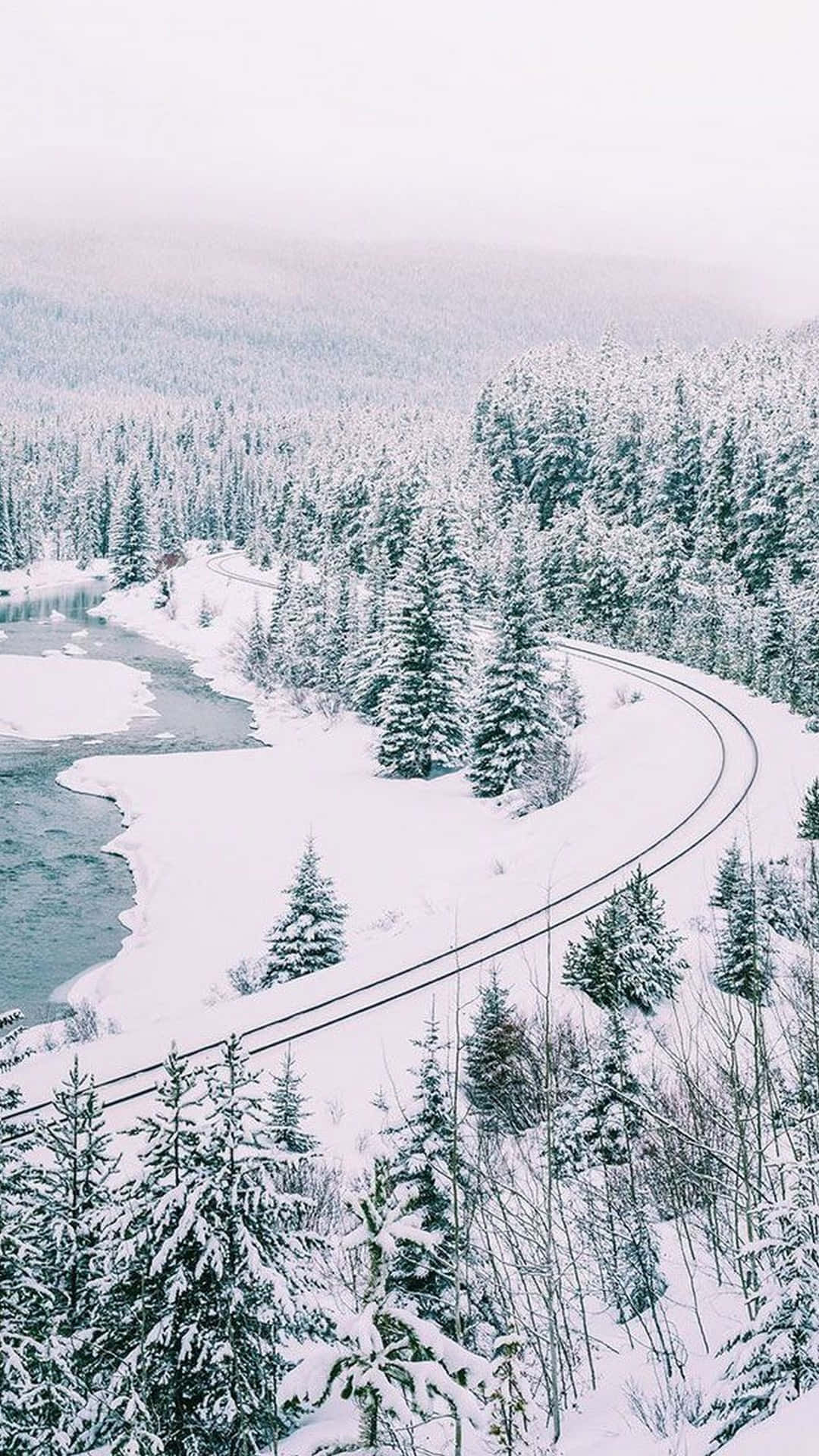 A Snow Covered Road And A River