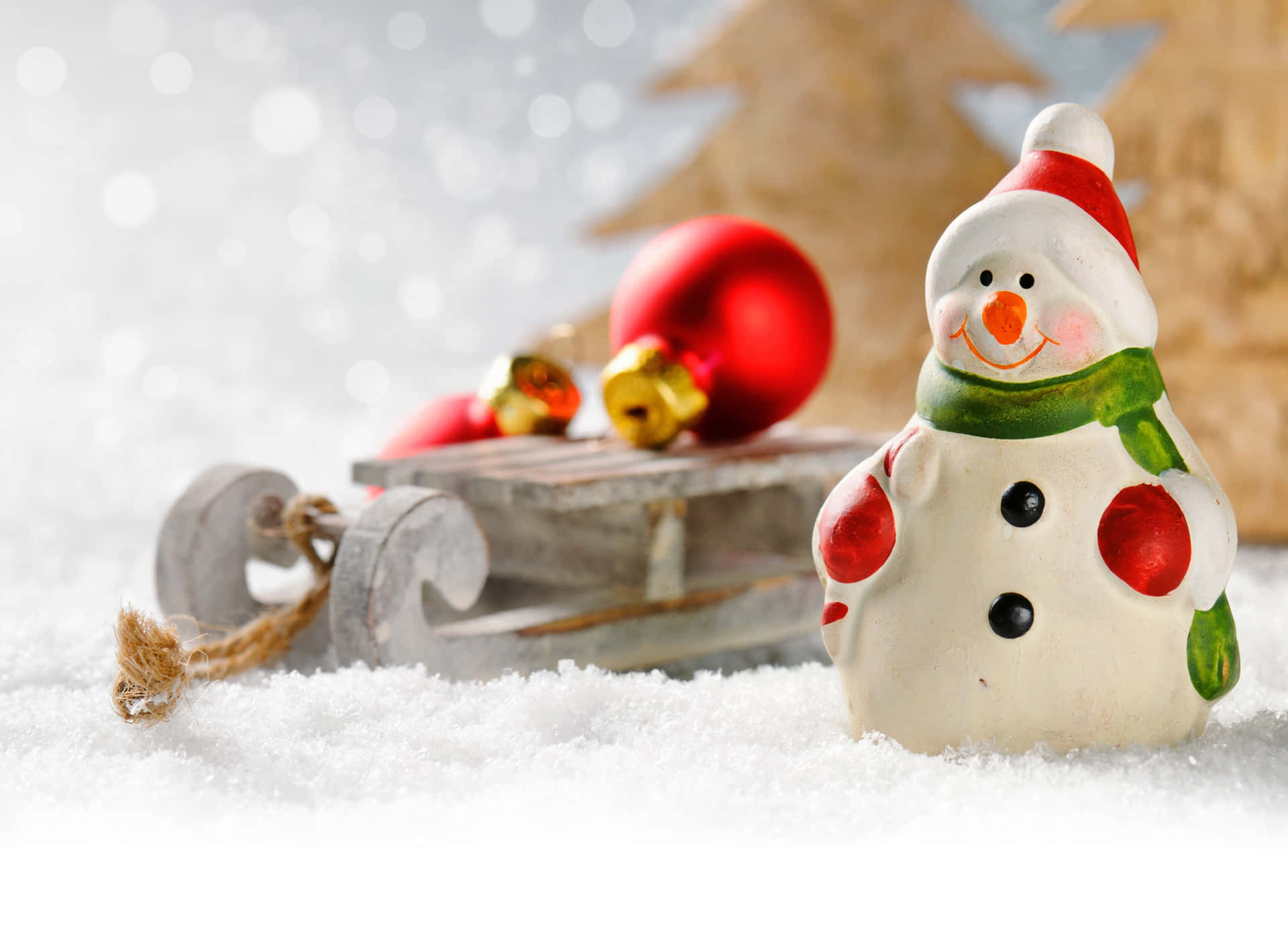 A Snowman Is Sitting On A Snowy Background Background