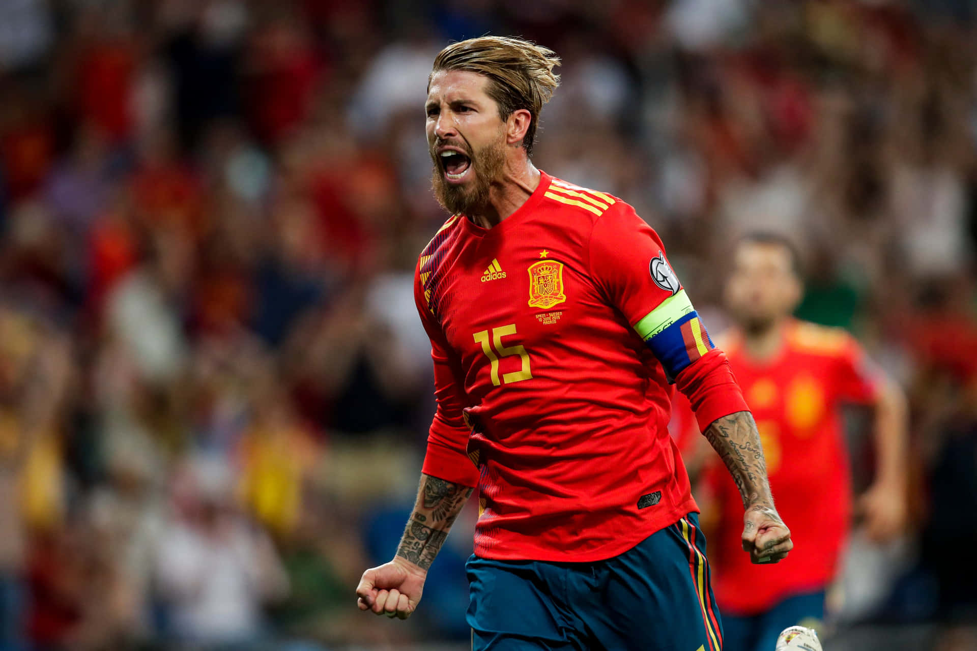 A Soccer Player Celebrating His Goal Background