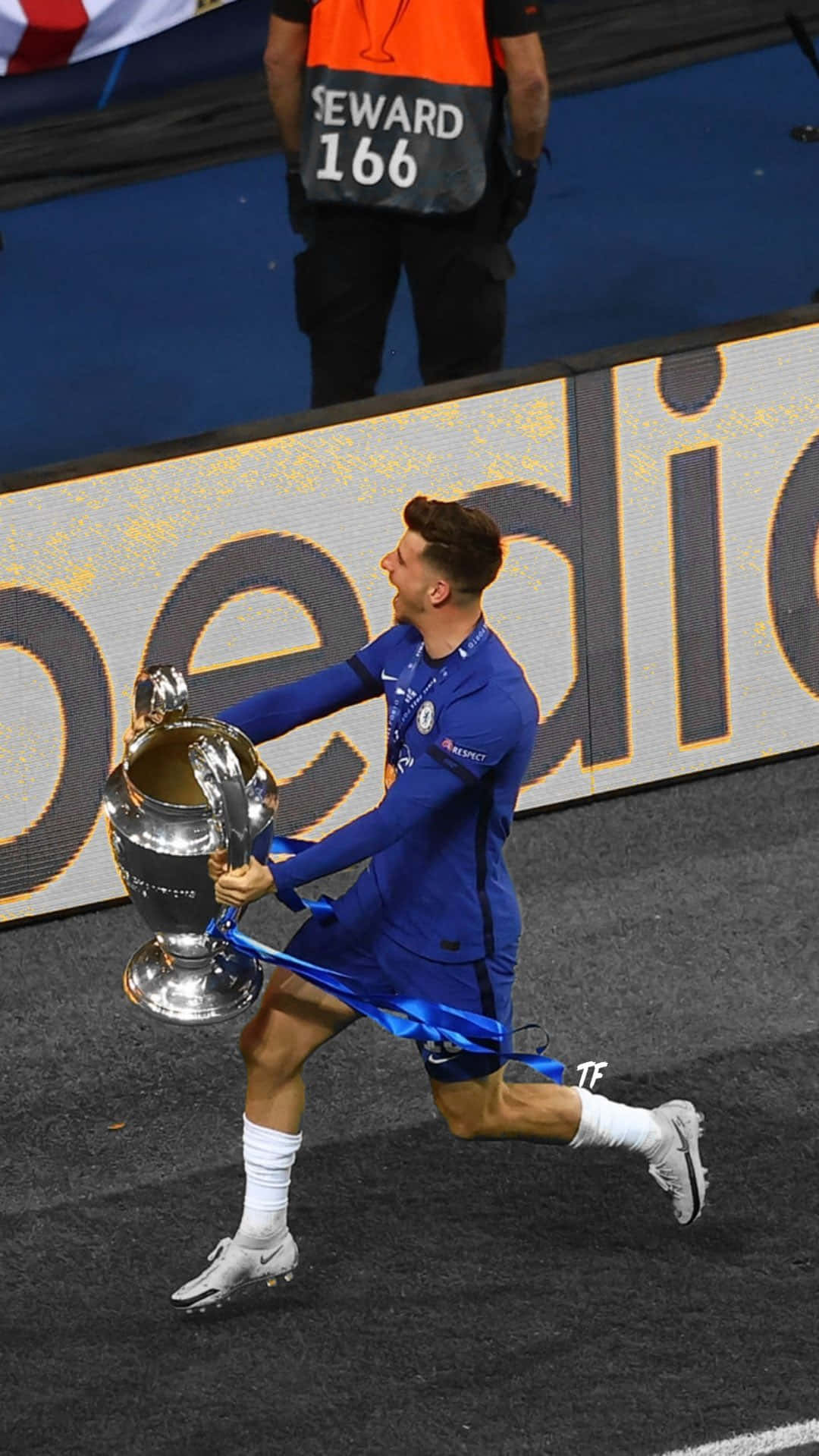 A Soccer Player Is Holding A Trophy Background