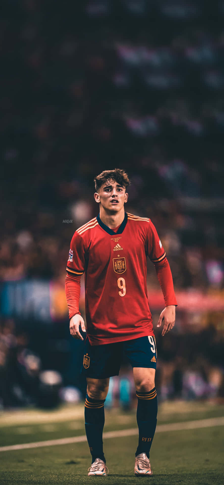 A Soccer Player Is Standing On The Field Background