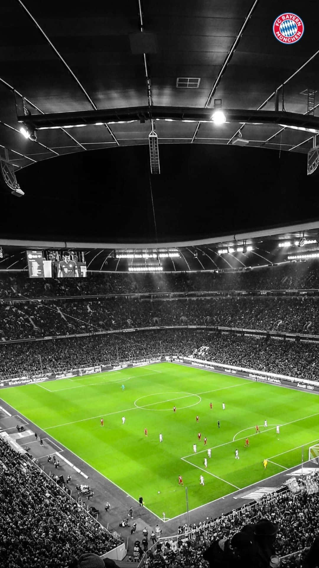 A Soccer Stadium With Lights On And A Soccer Game Background