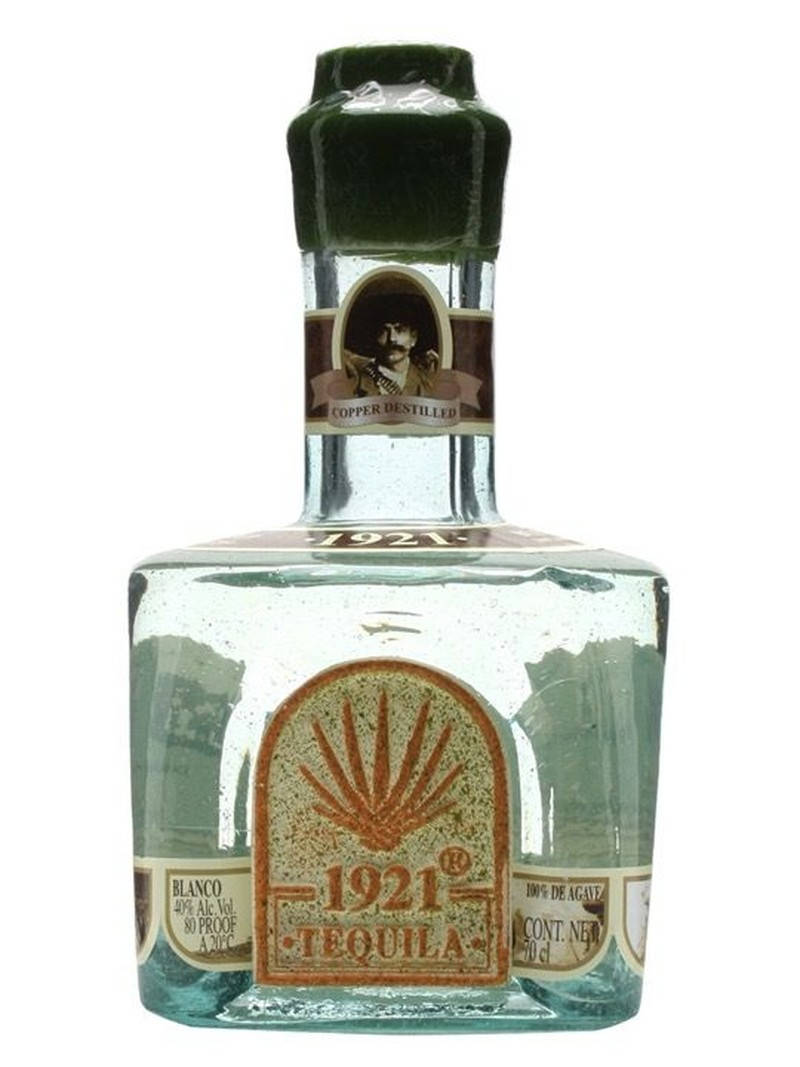 A Sophisticated Bottle Of 1921 Tequila Blanco, Showcasing Elegance And Tradition.