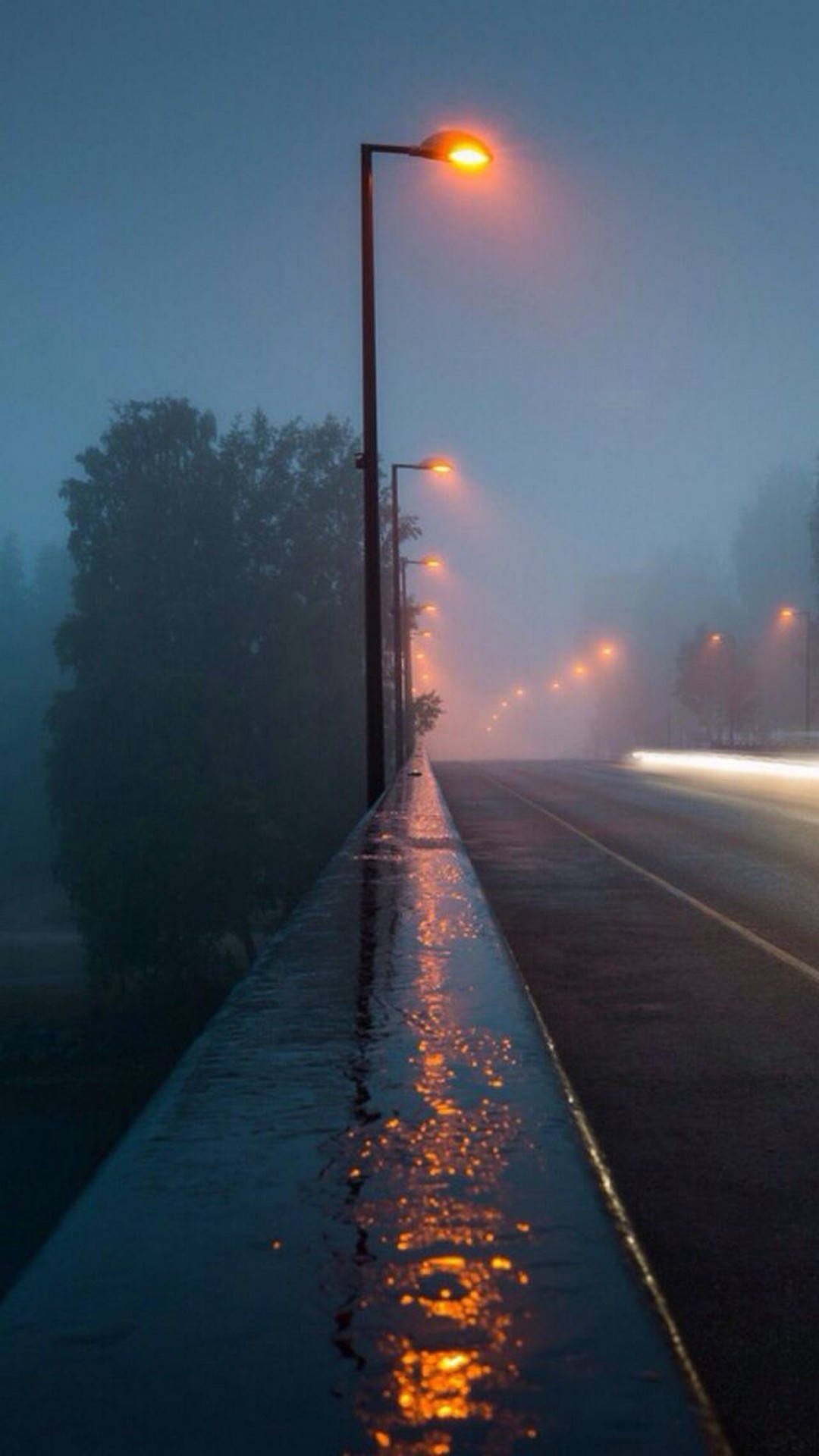 A Spectacular Sight Of Rainfall On A Misty Highway Background