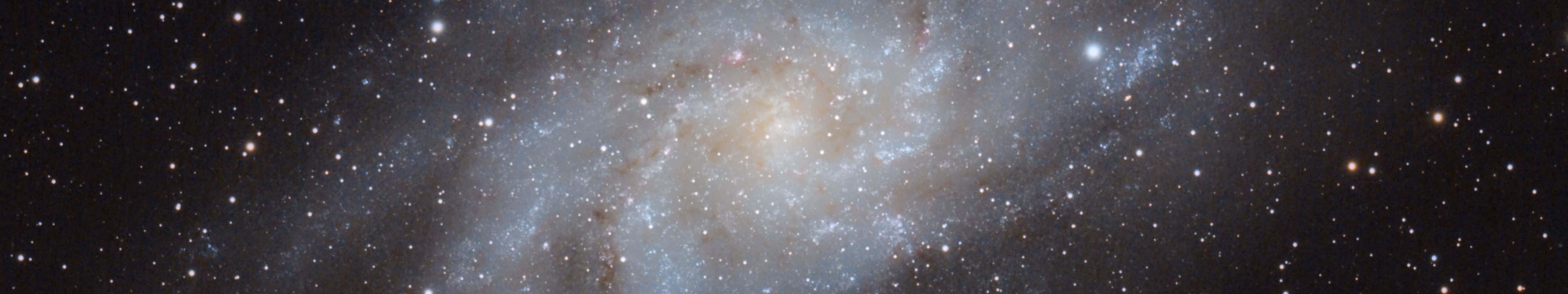 A Spiral Galaxy With Many Stars In It Background