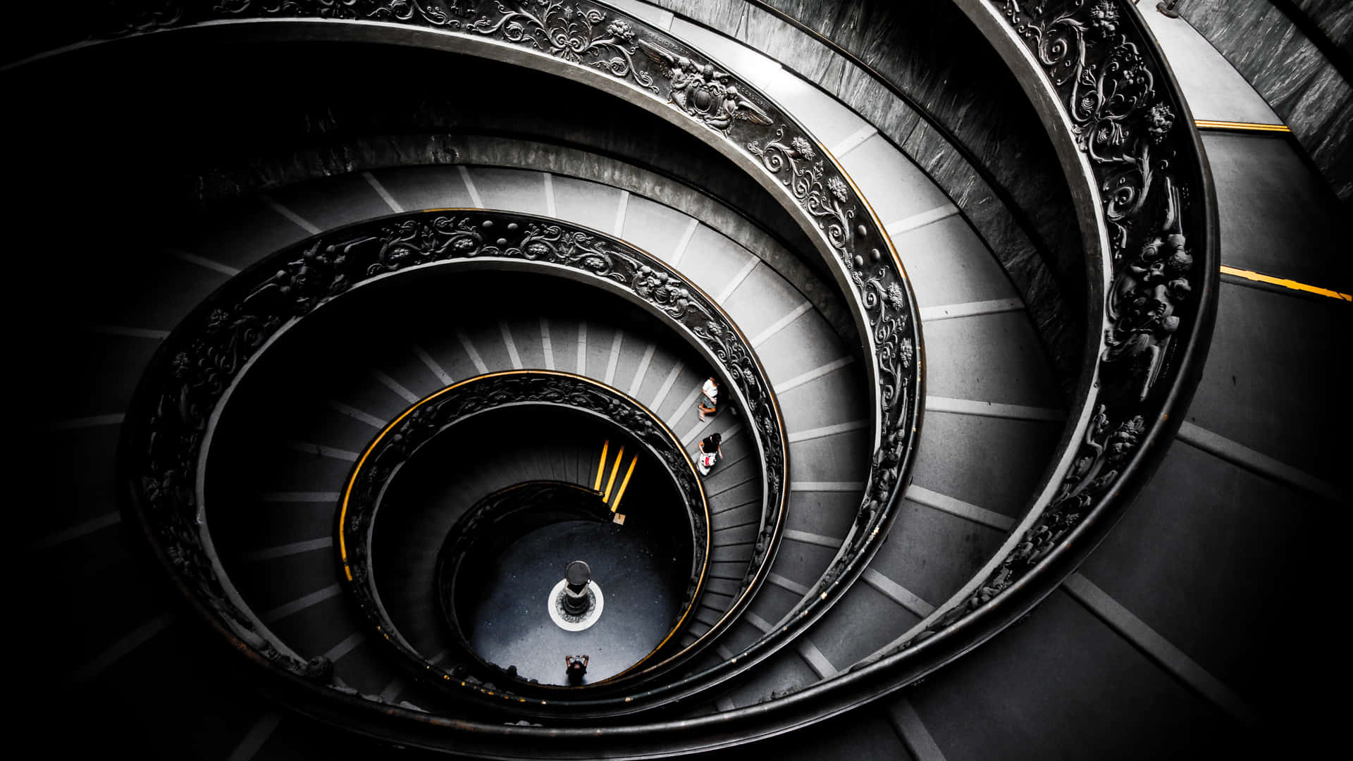 A Spiral Staircase With A Person On It