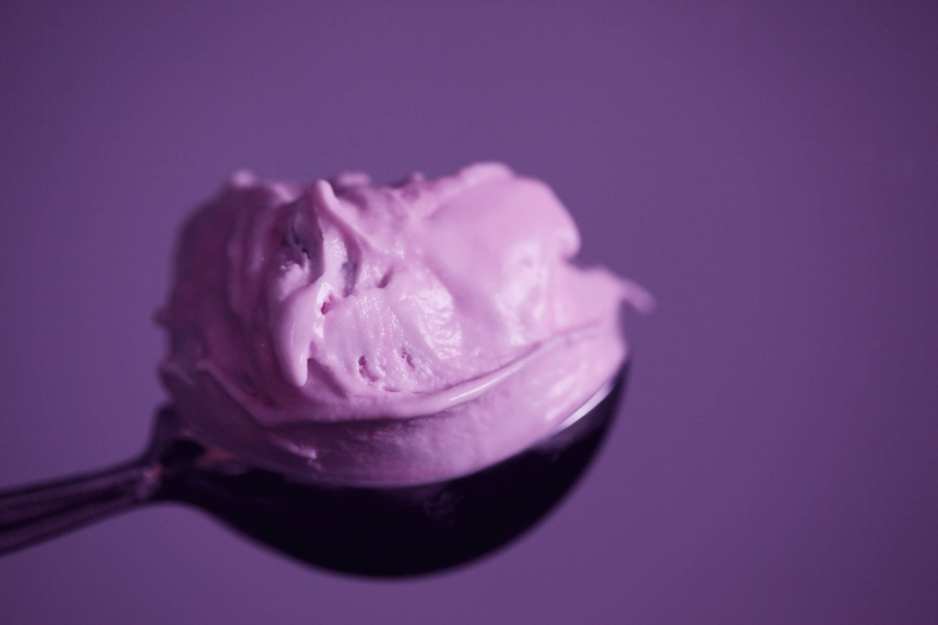 A Spoon With A Scoop Of Ice Cream On It Background