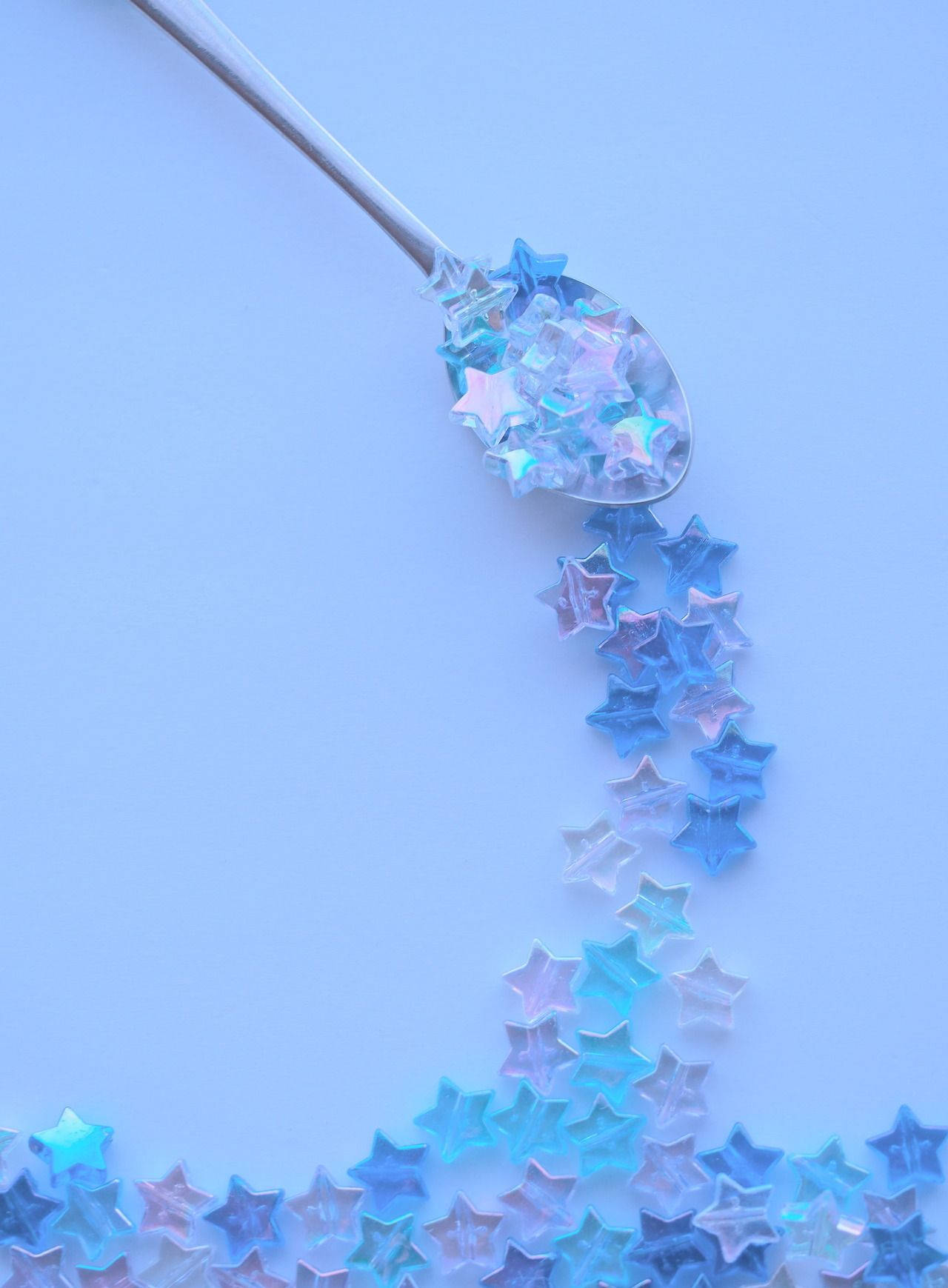 A Spoon With Stars On It Background