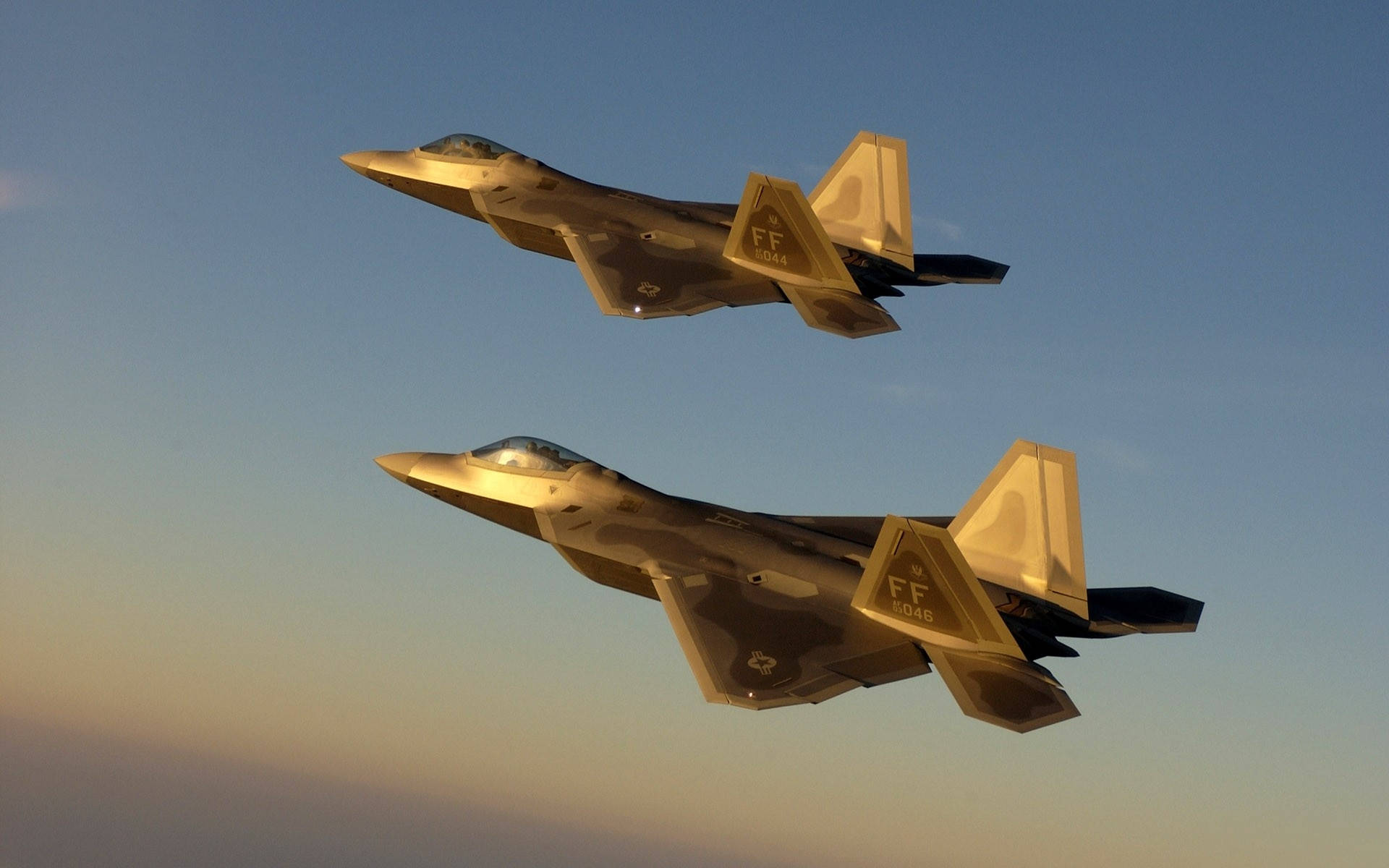 A Squadron Of Us Military Jets Fly In Formation Over A Desert Landscape Background