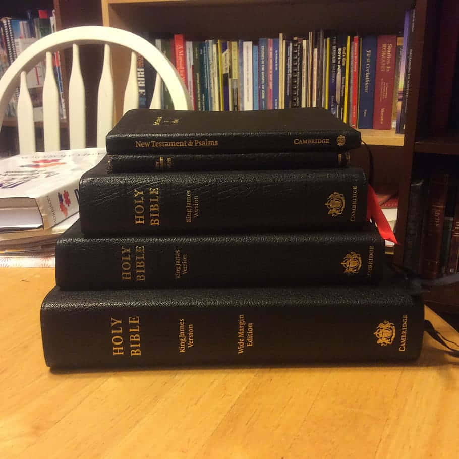 A Stack Of Books On A Table Background