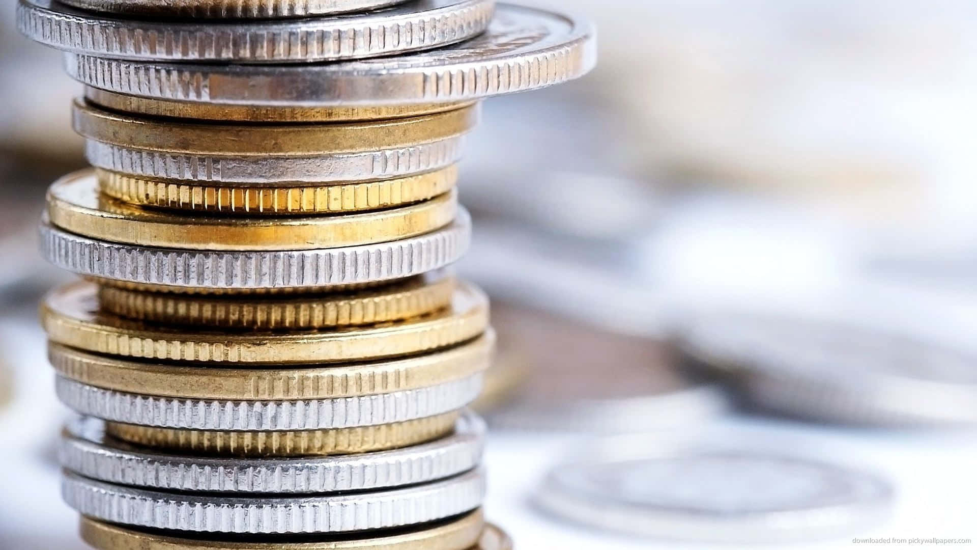 A Stack Of Gleaming Silver And Gold Coins Background