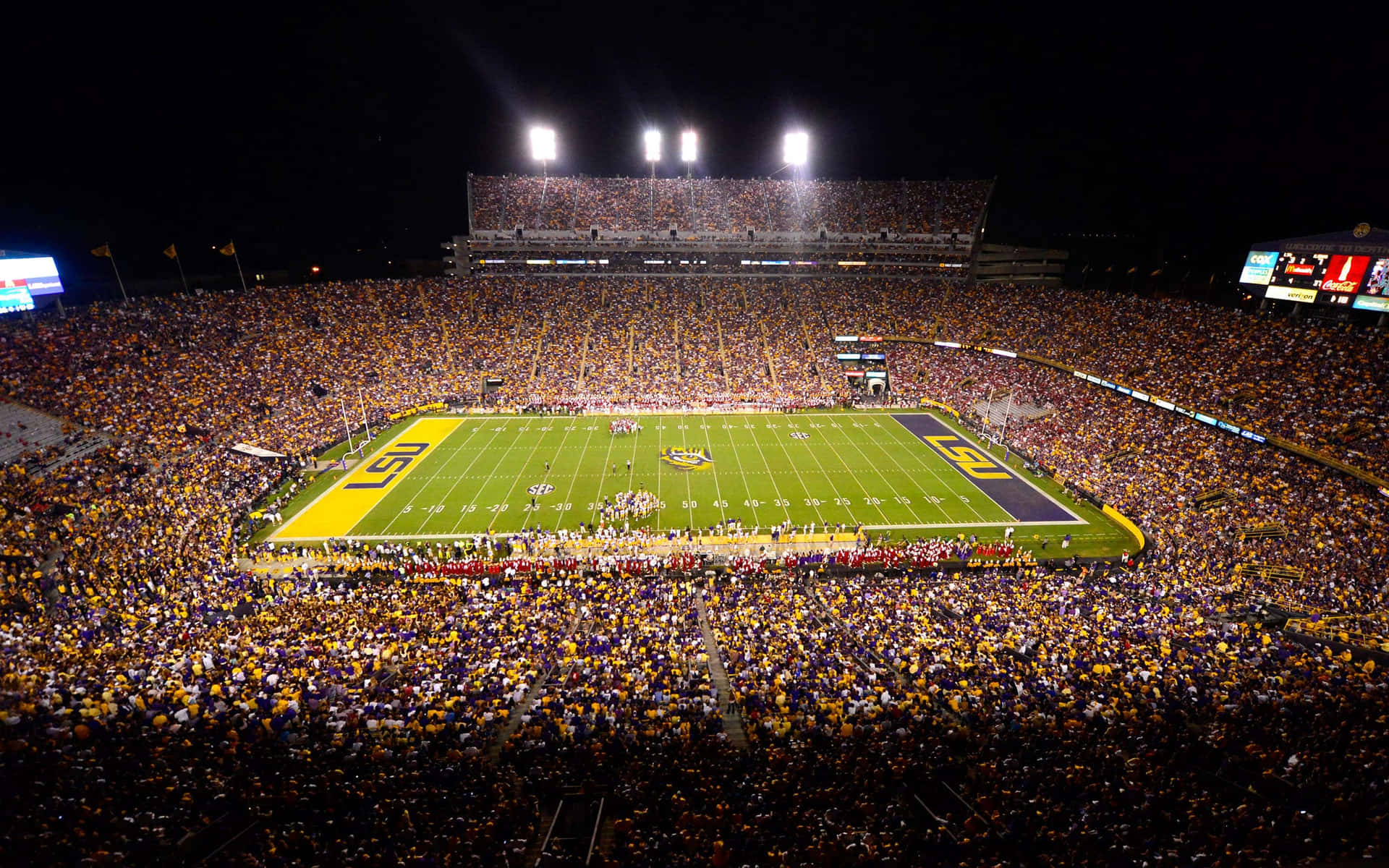 A Stadium With A Lot Of People Background