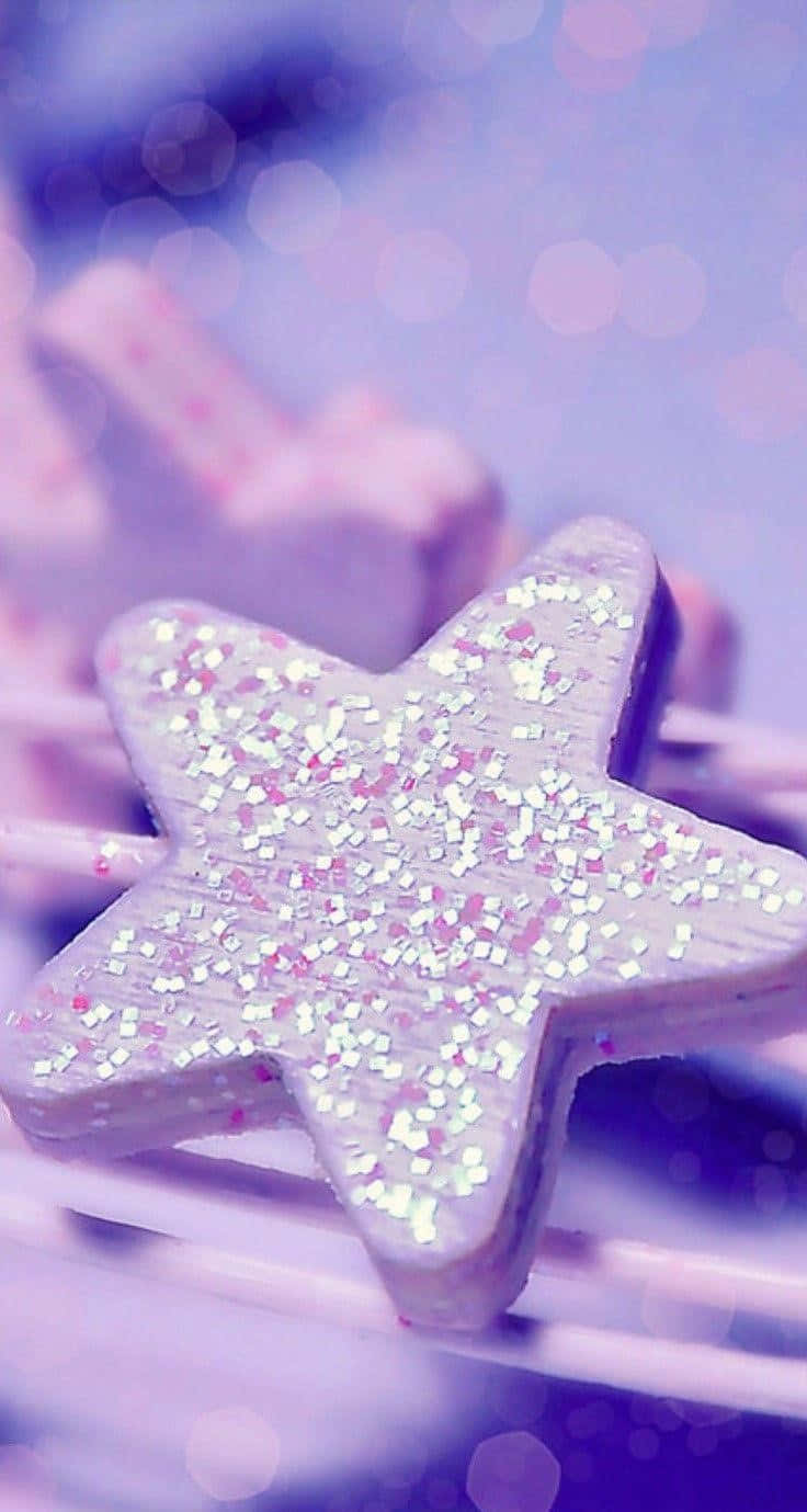 A Star Shaped Cookie On A Purple Background