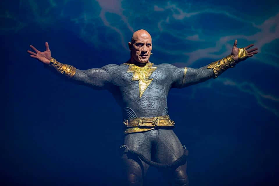 A Statue Of A Man In A Gold Suit Background