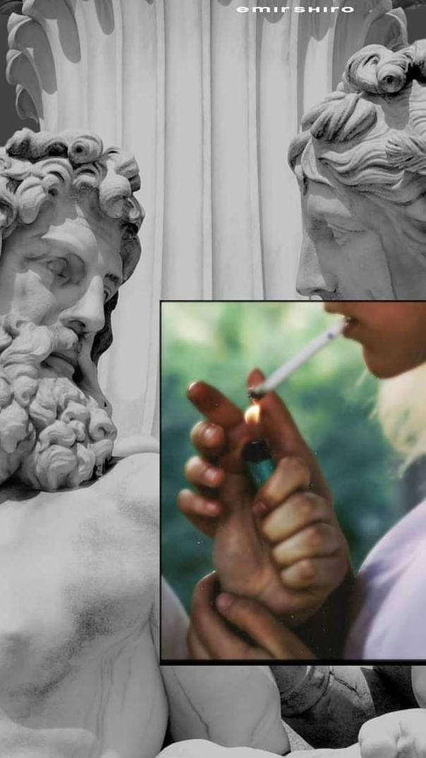 A Statue Of A Man Smoking A Cigarette