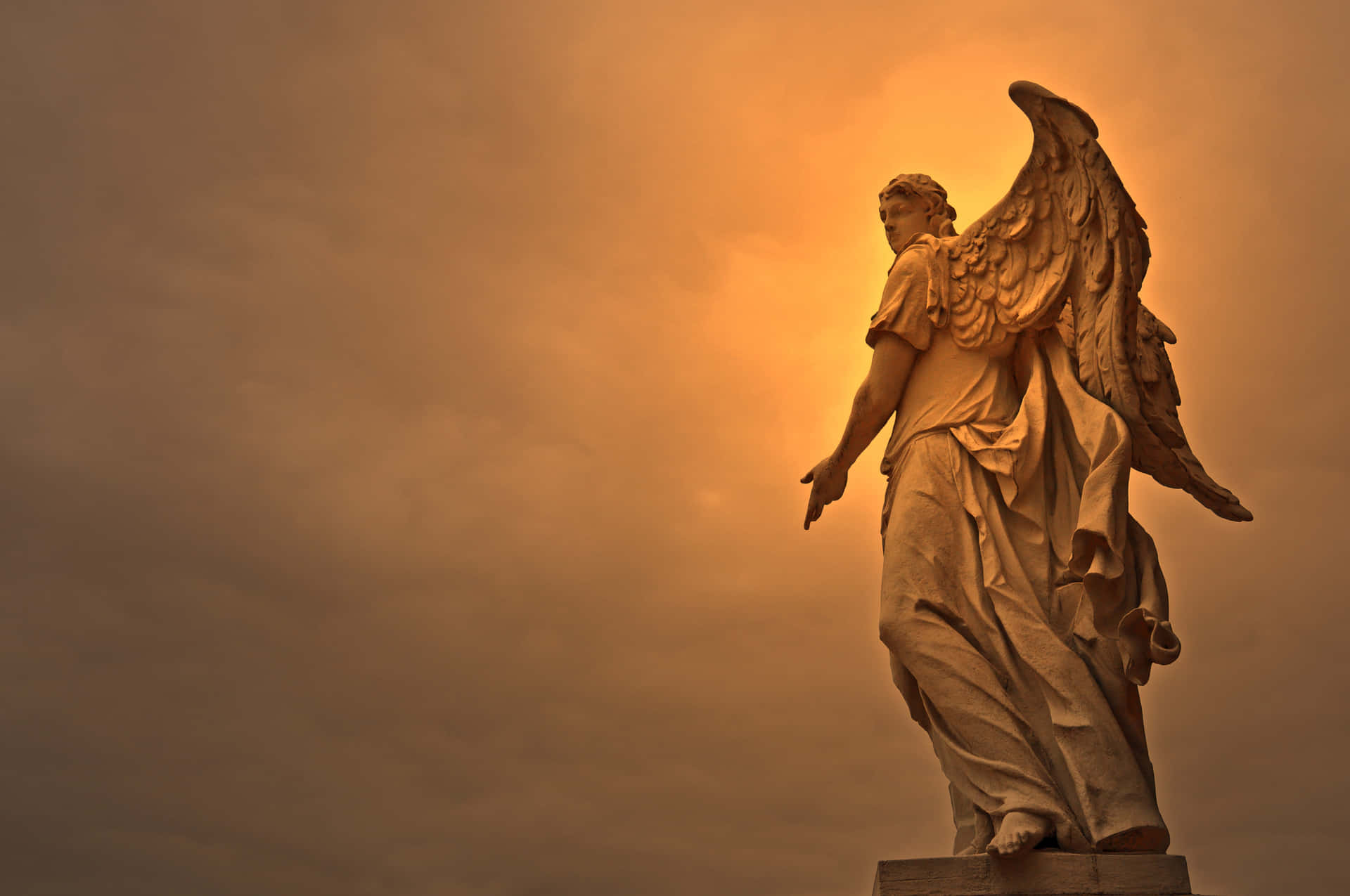 A Statue Of An Angel With Wings In The Sky Background