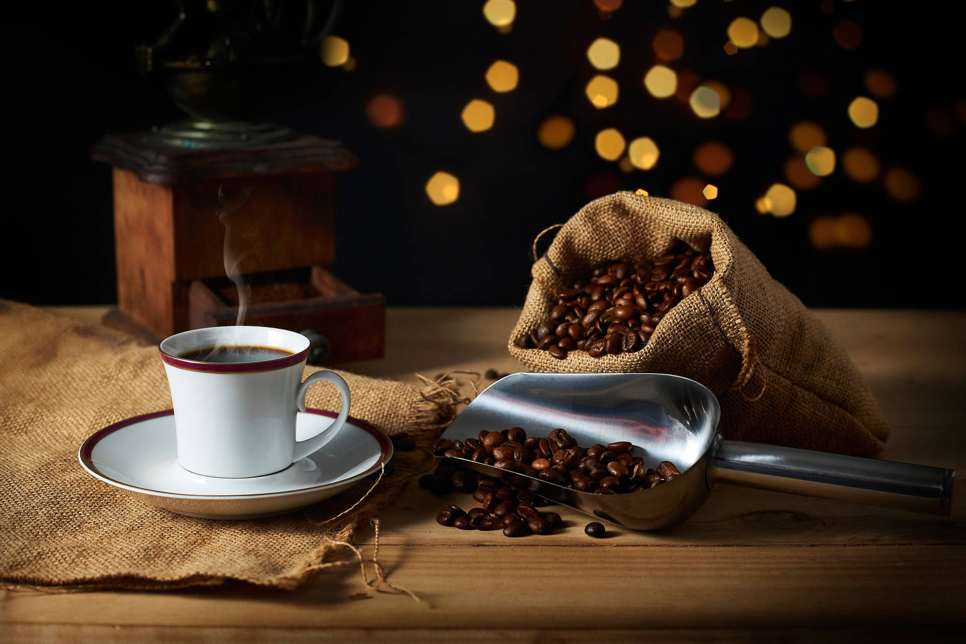 A Steamy Mug Of Fresh Hot Coffee Surrounded By Aromatic Coffee Beans. Background