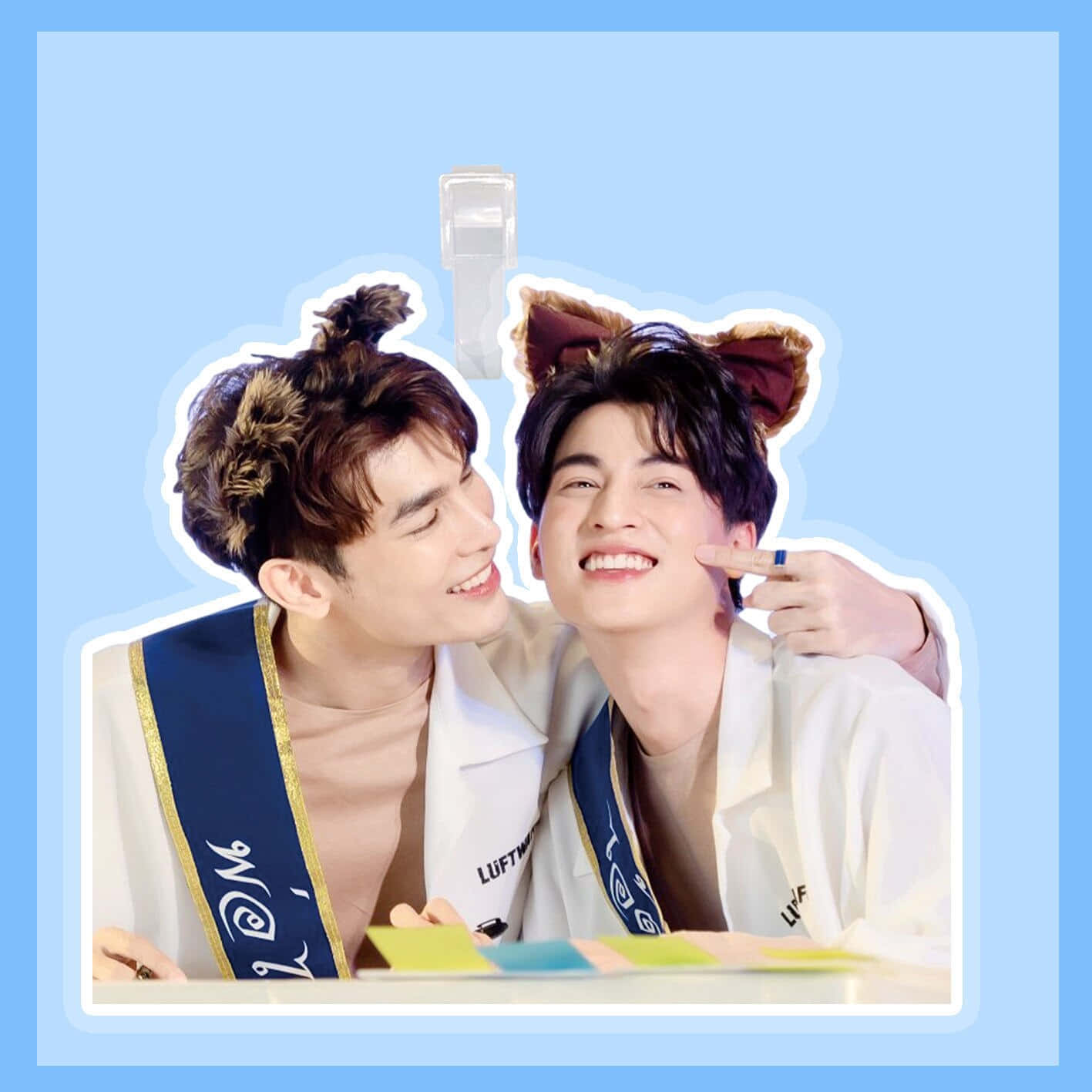 A Sticker With Two Boys In A Blue Shirt Background