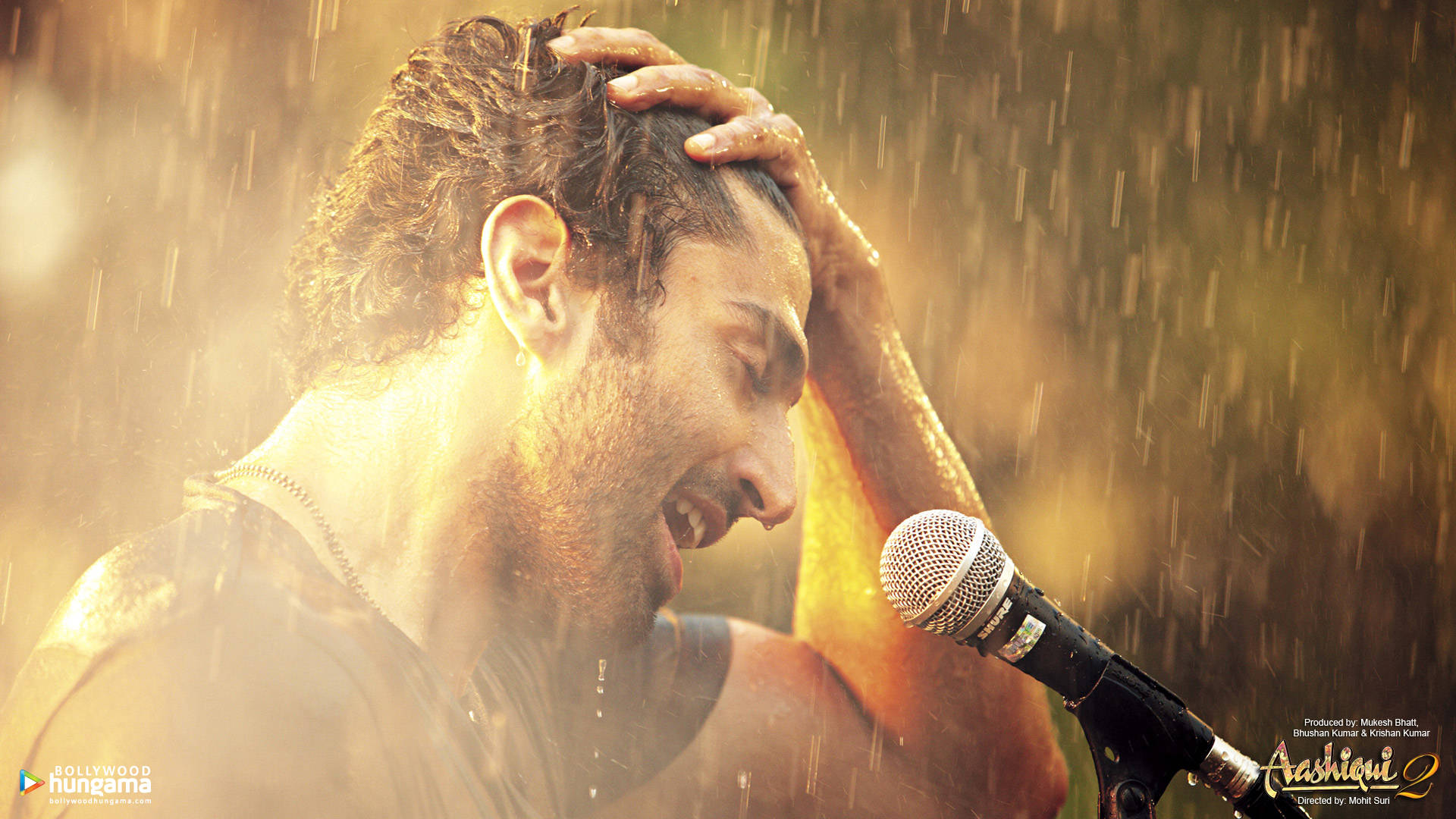 A Still From Aashiqui 2: Rahul Jaykar Enveloped By Rain Background