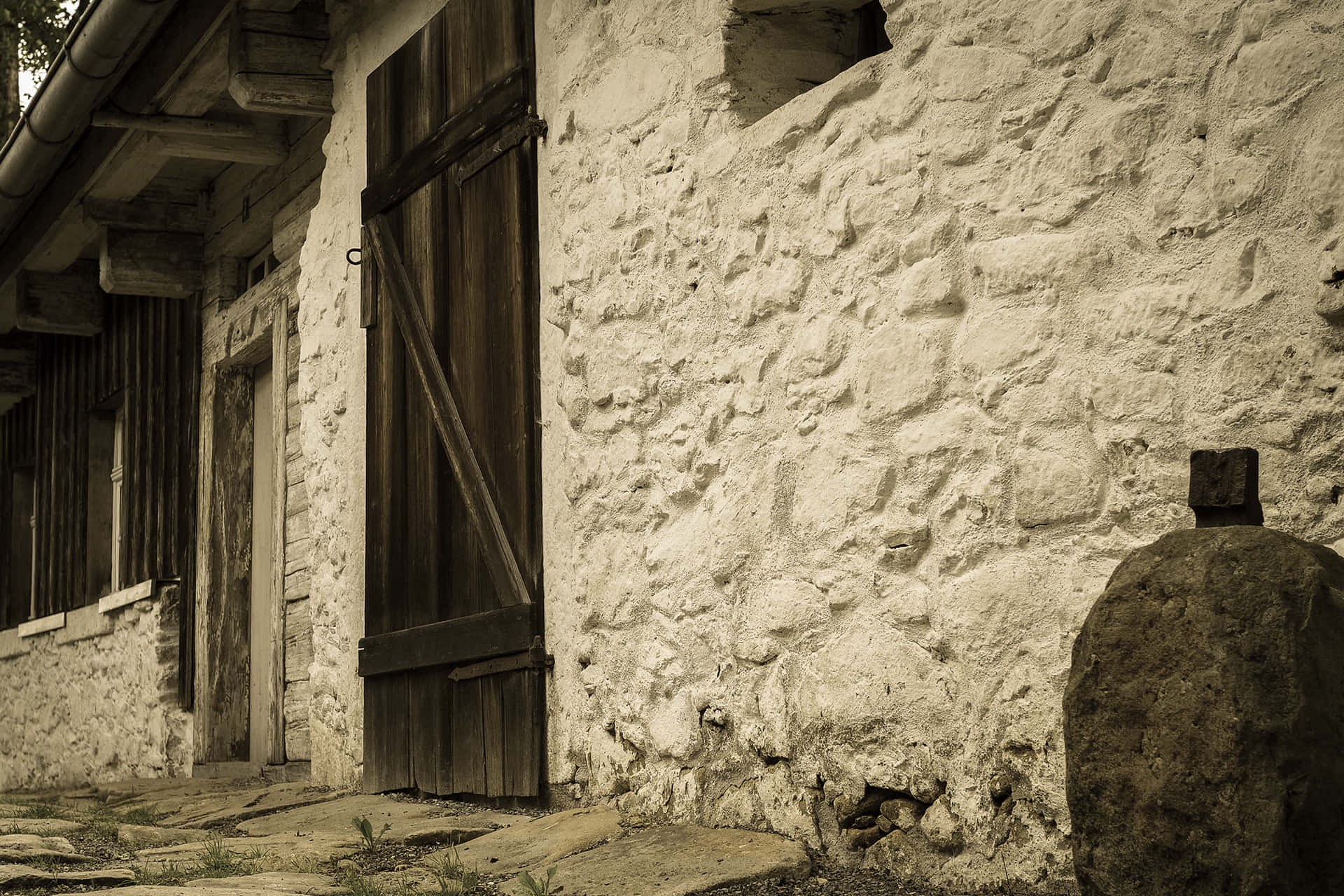 A Stone Building With A Door Background