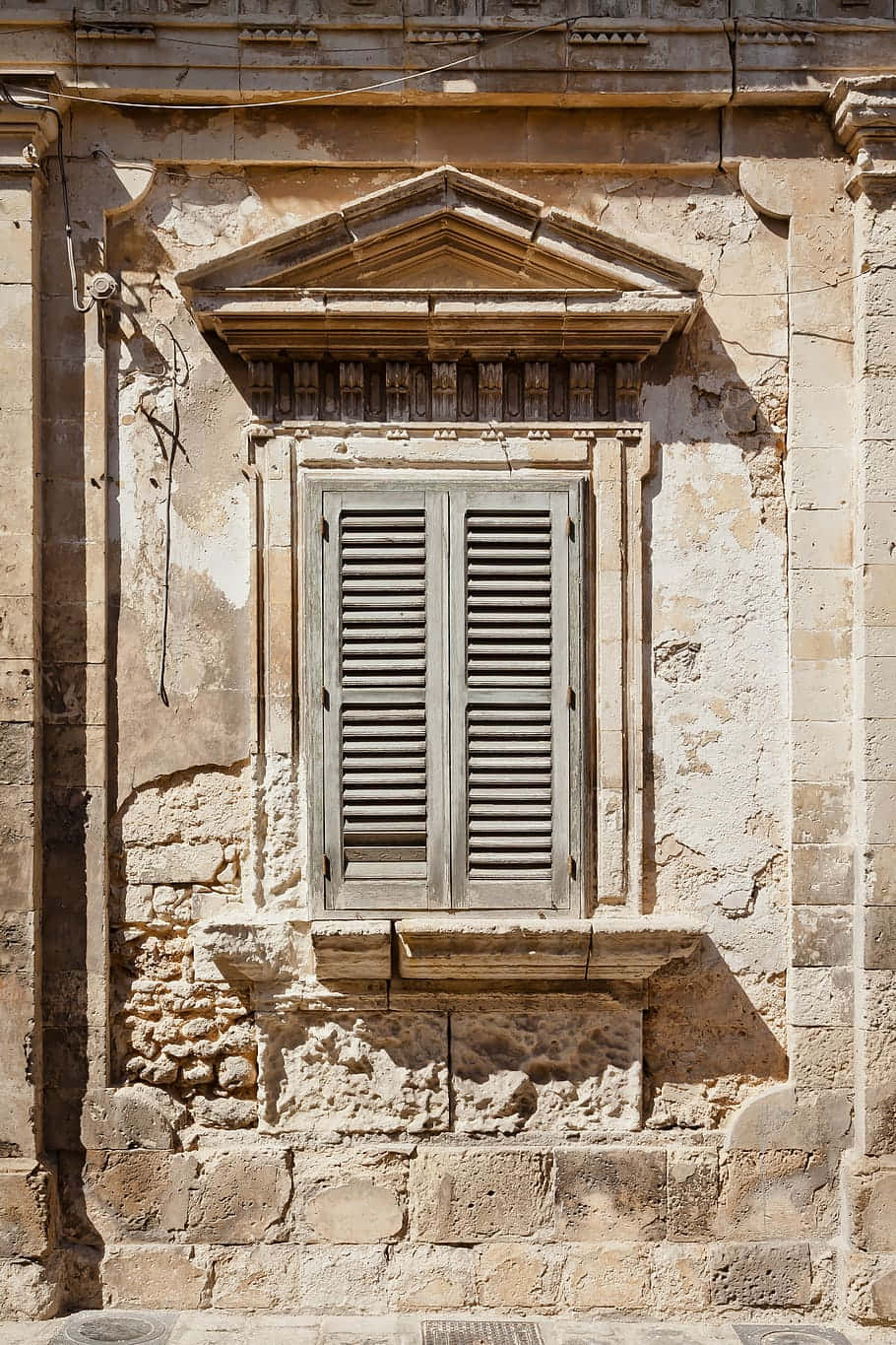 A Stone Building With A Window