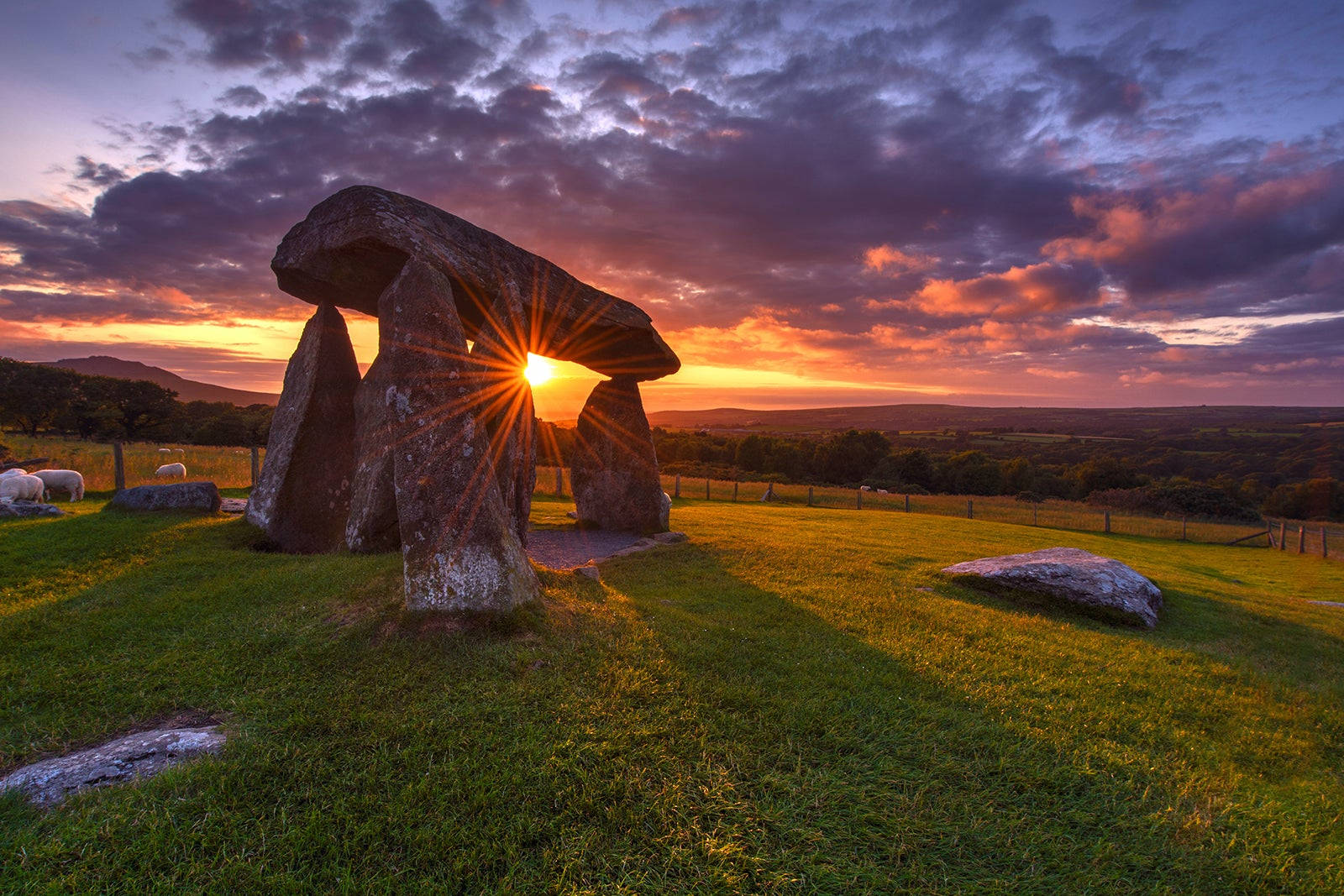 A Stone Circle In The Grass Background