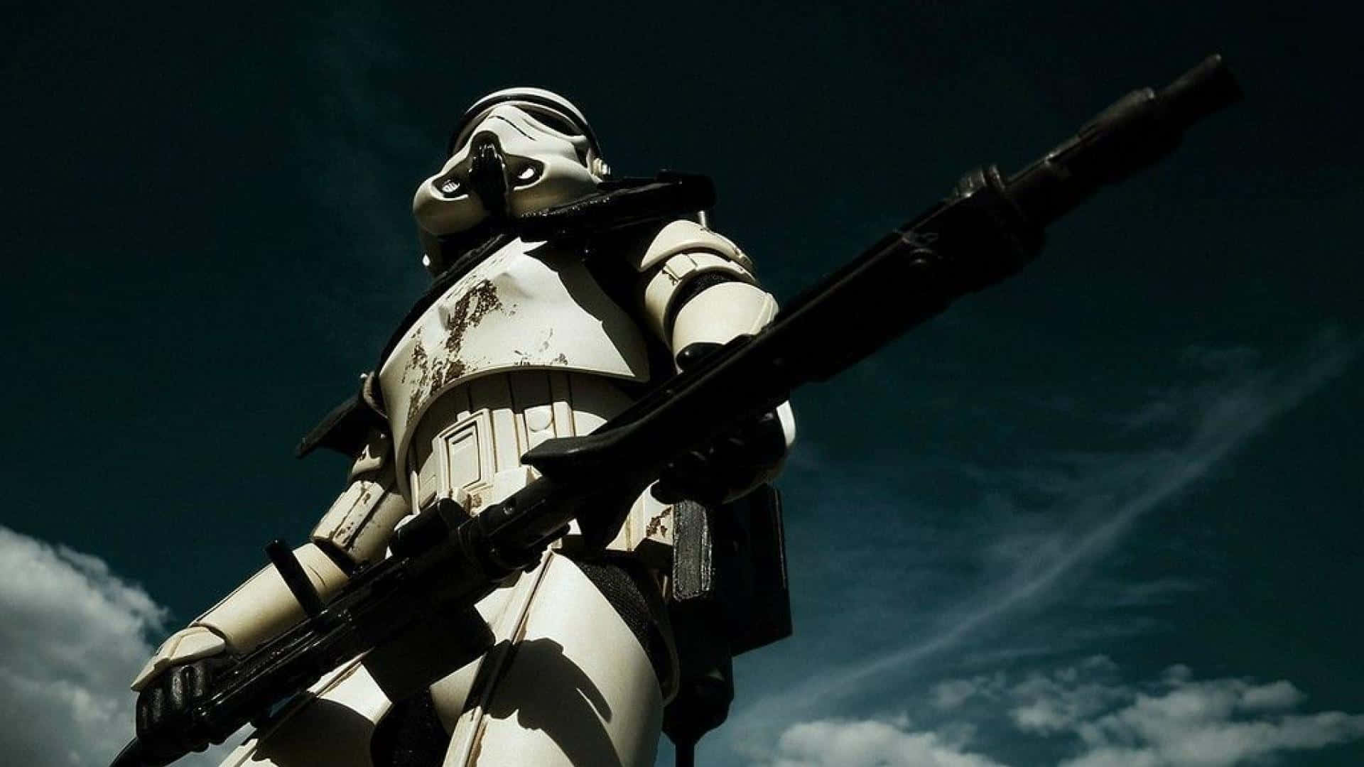 A Stormtrooper Is Standing In The Sky With A Rifle Background