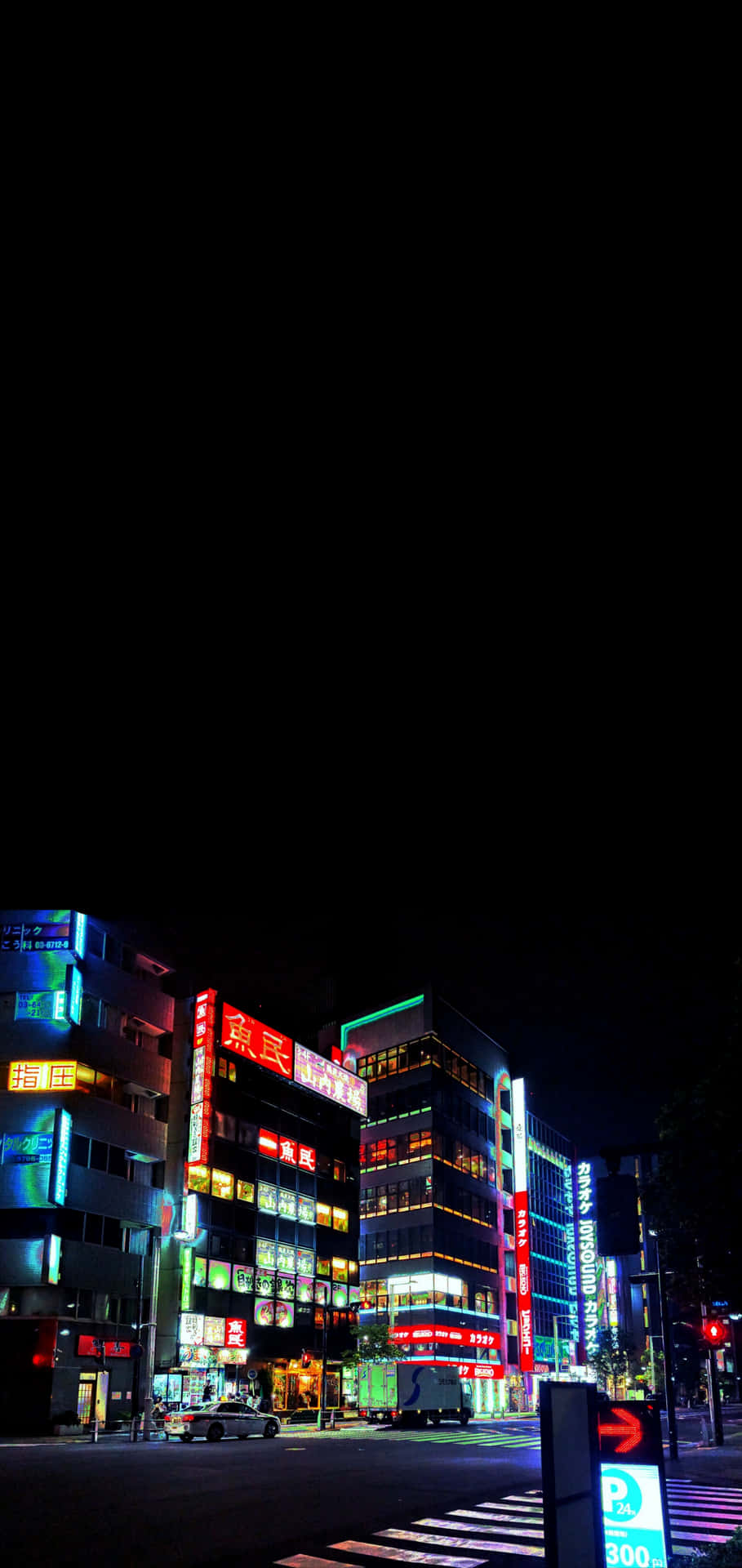 A Street With Buildings And A Street Light Background