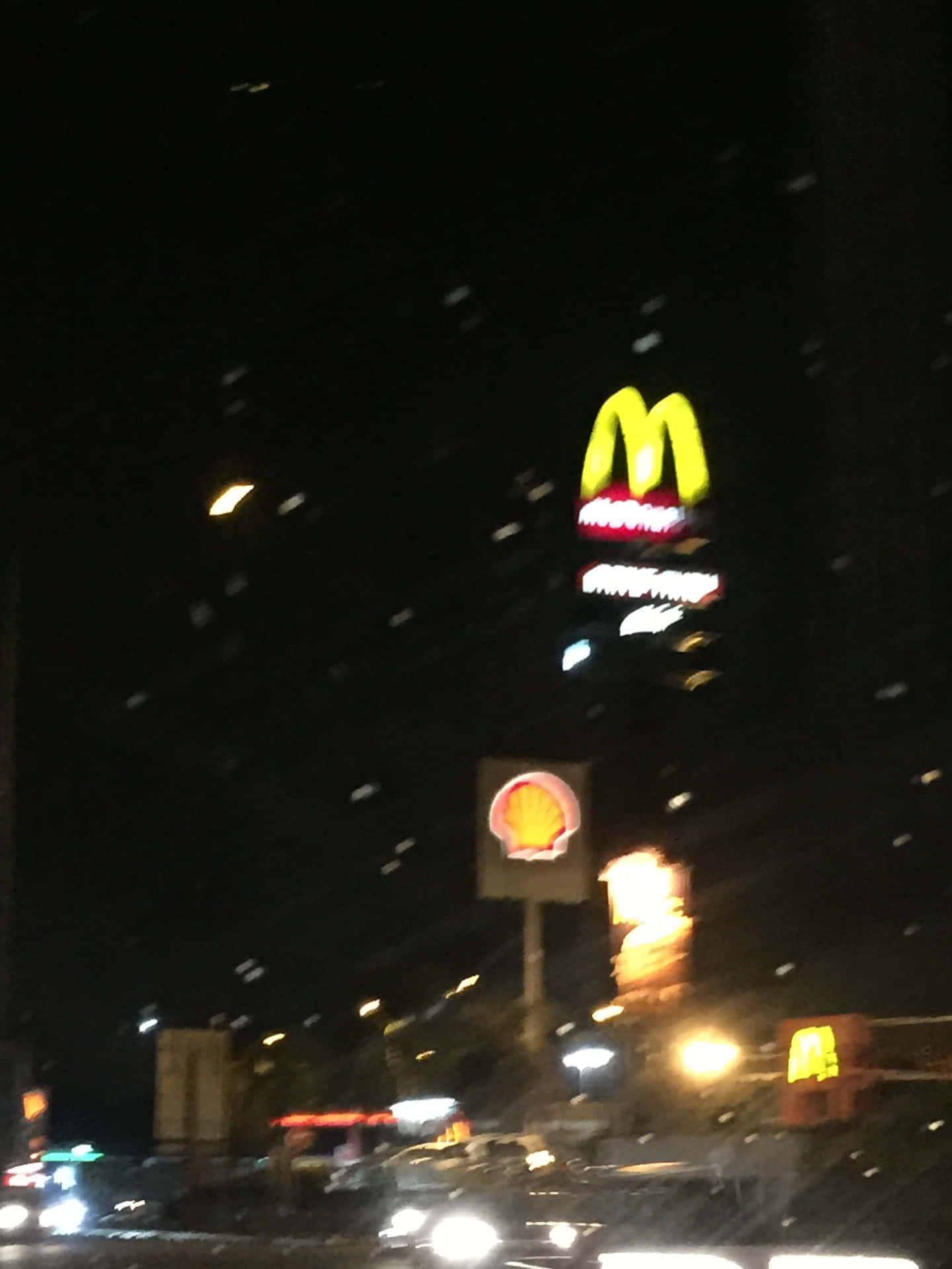 A Street With Cars Driving Down It At Night Background