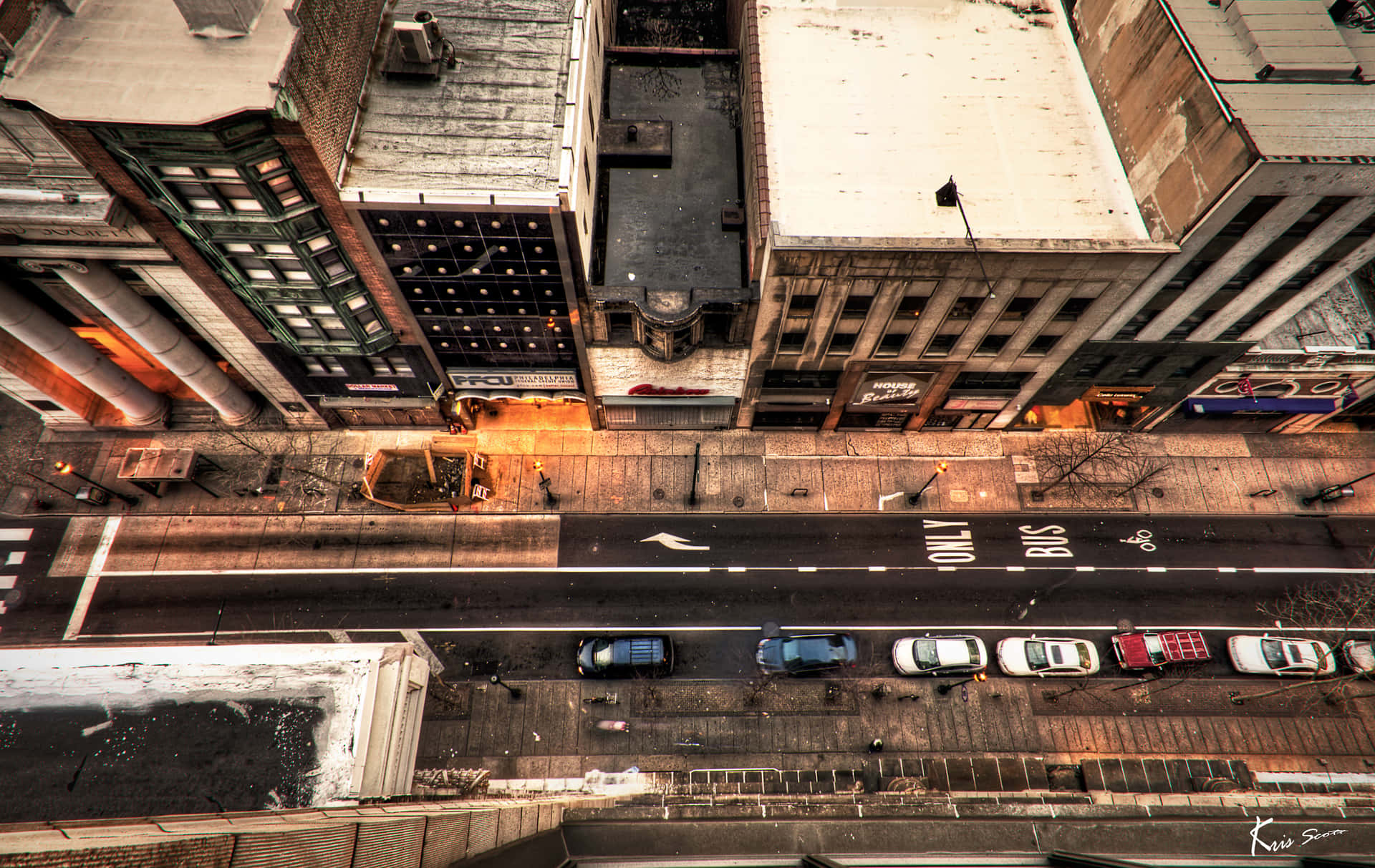 A Street With Cars Parked On It Background