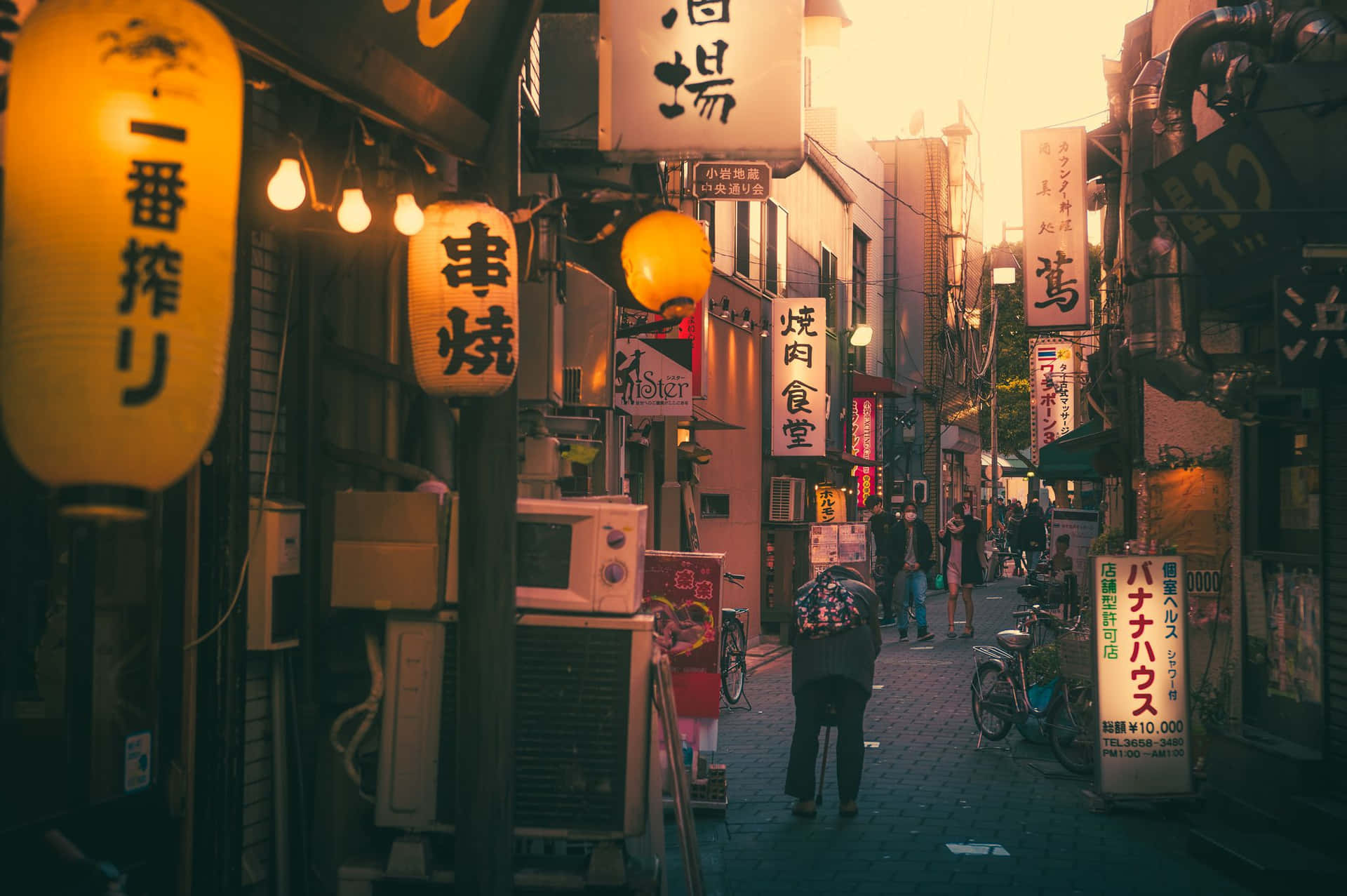 A Street With Many Signs Background