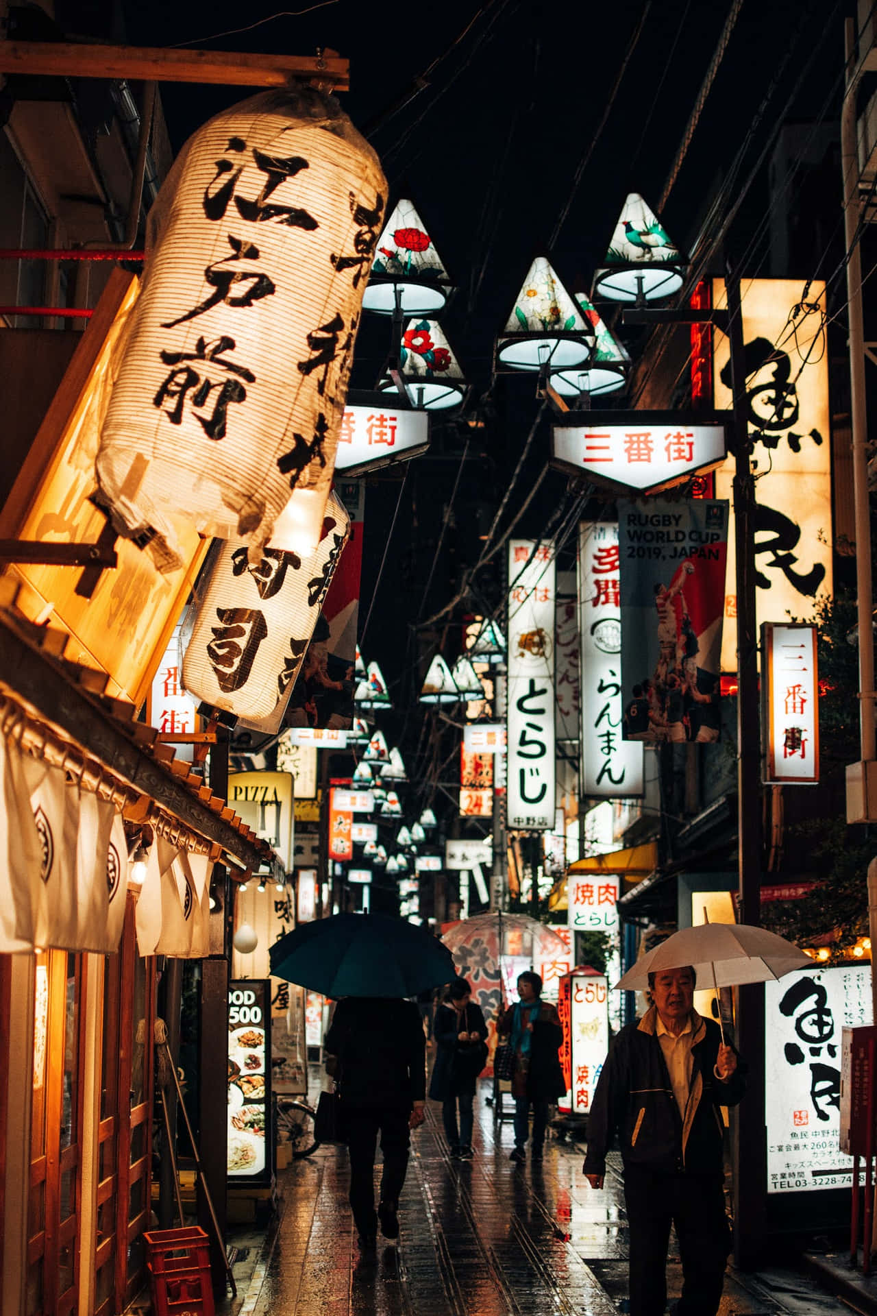 A Street With Many Signs Background