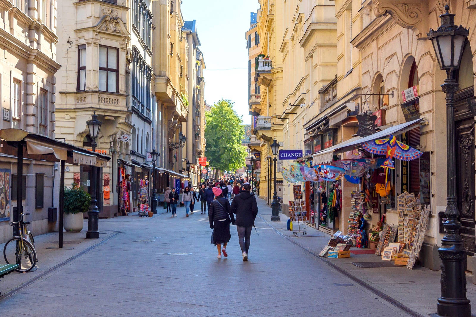 A Street With People Walking Down It