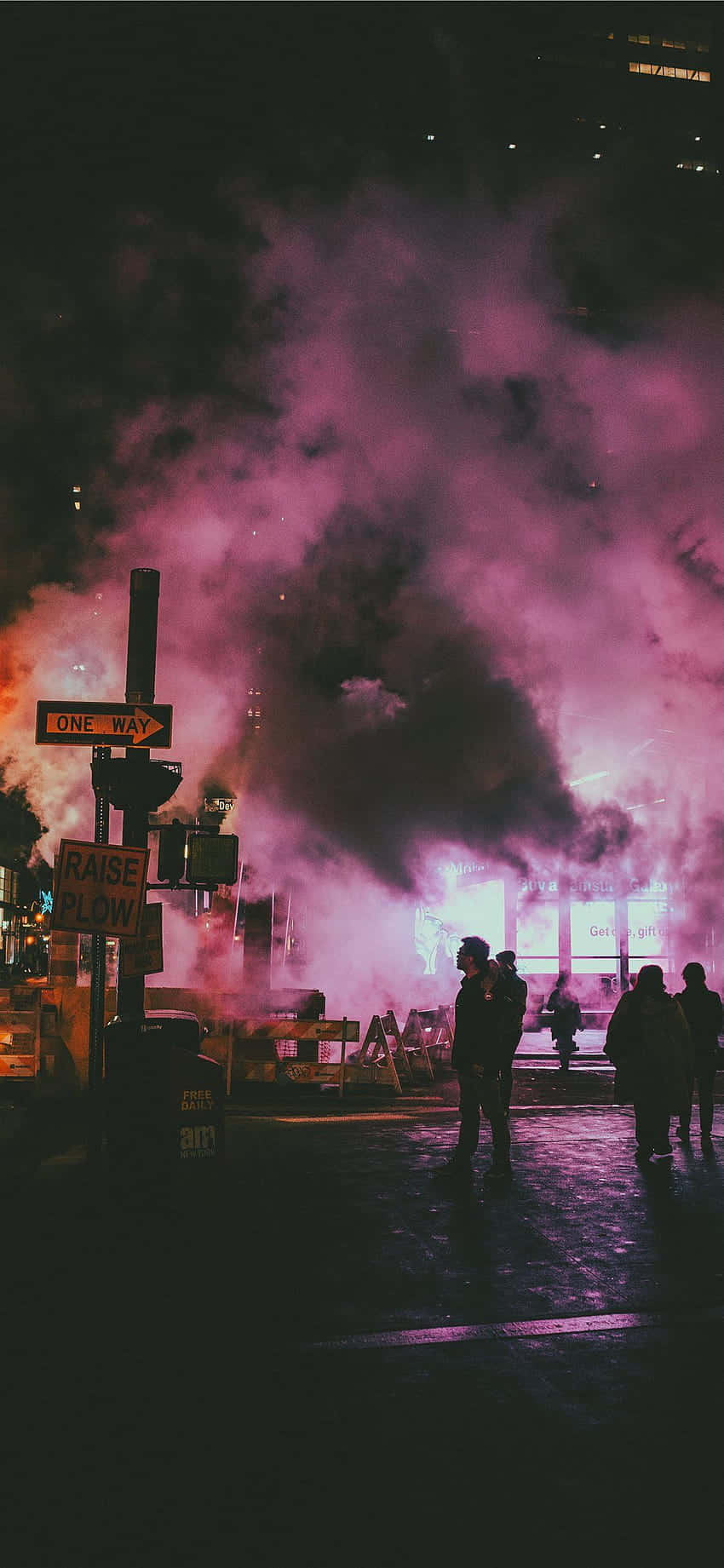 A Street With People Walking In The Dark