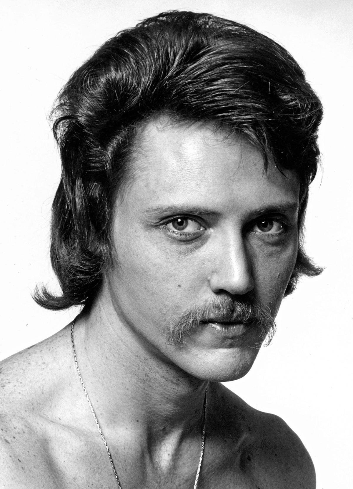 A Striking Black & White Portrait Of Young Christopher Walken Background