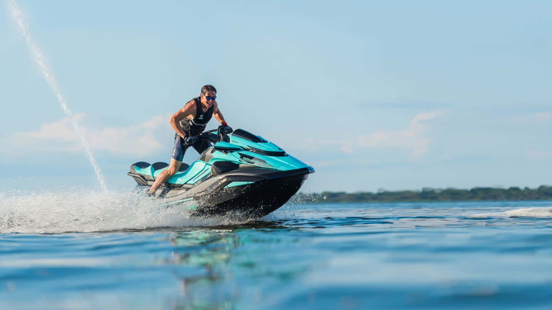 A Striking Blue And Black Jet Ski, Gliding Seamlessly Through The Water