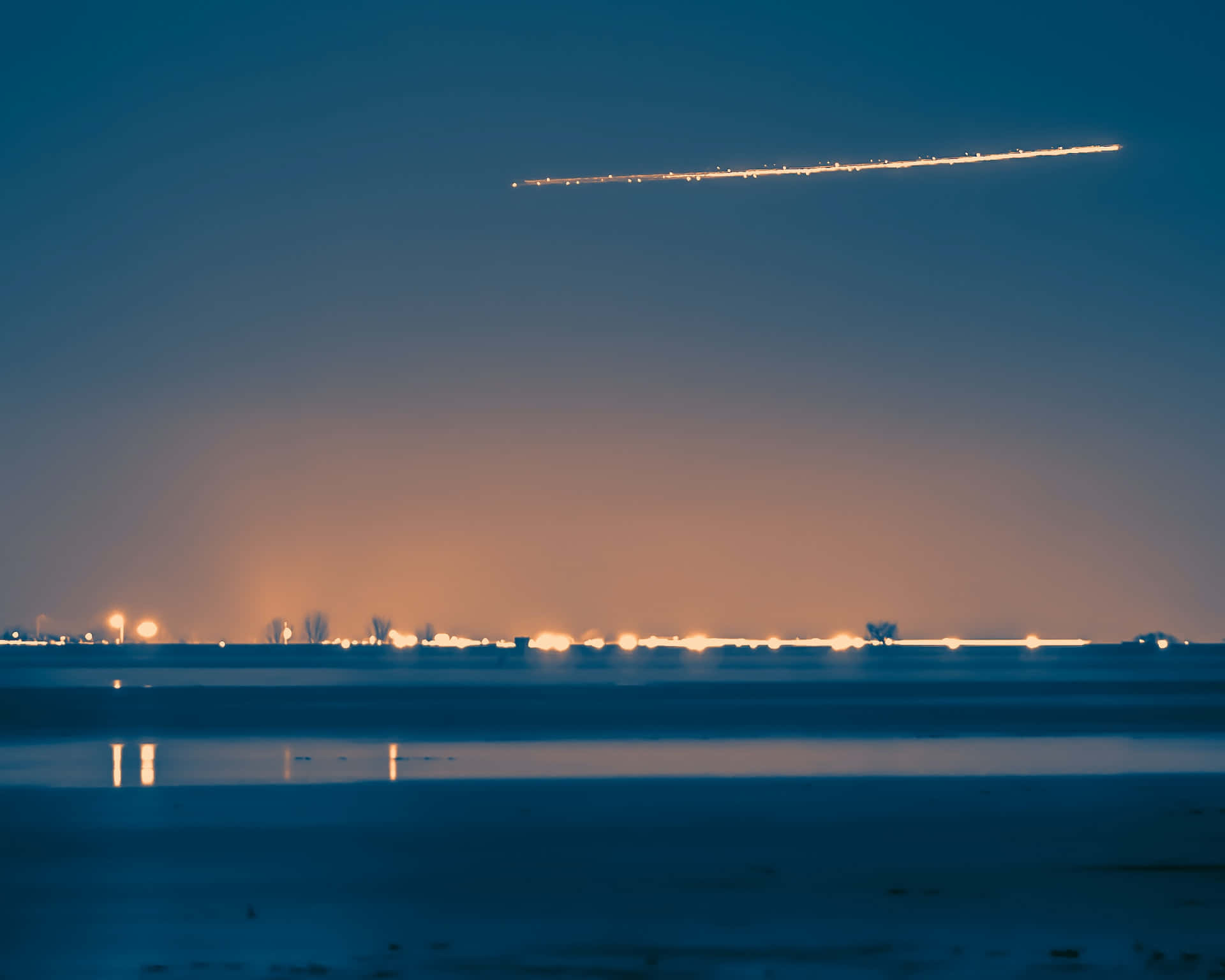 A Stunning Comet Soaring Through The Night Sky Background