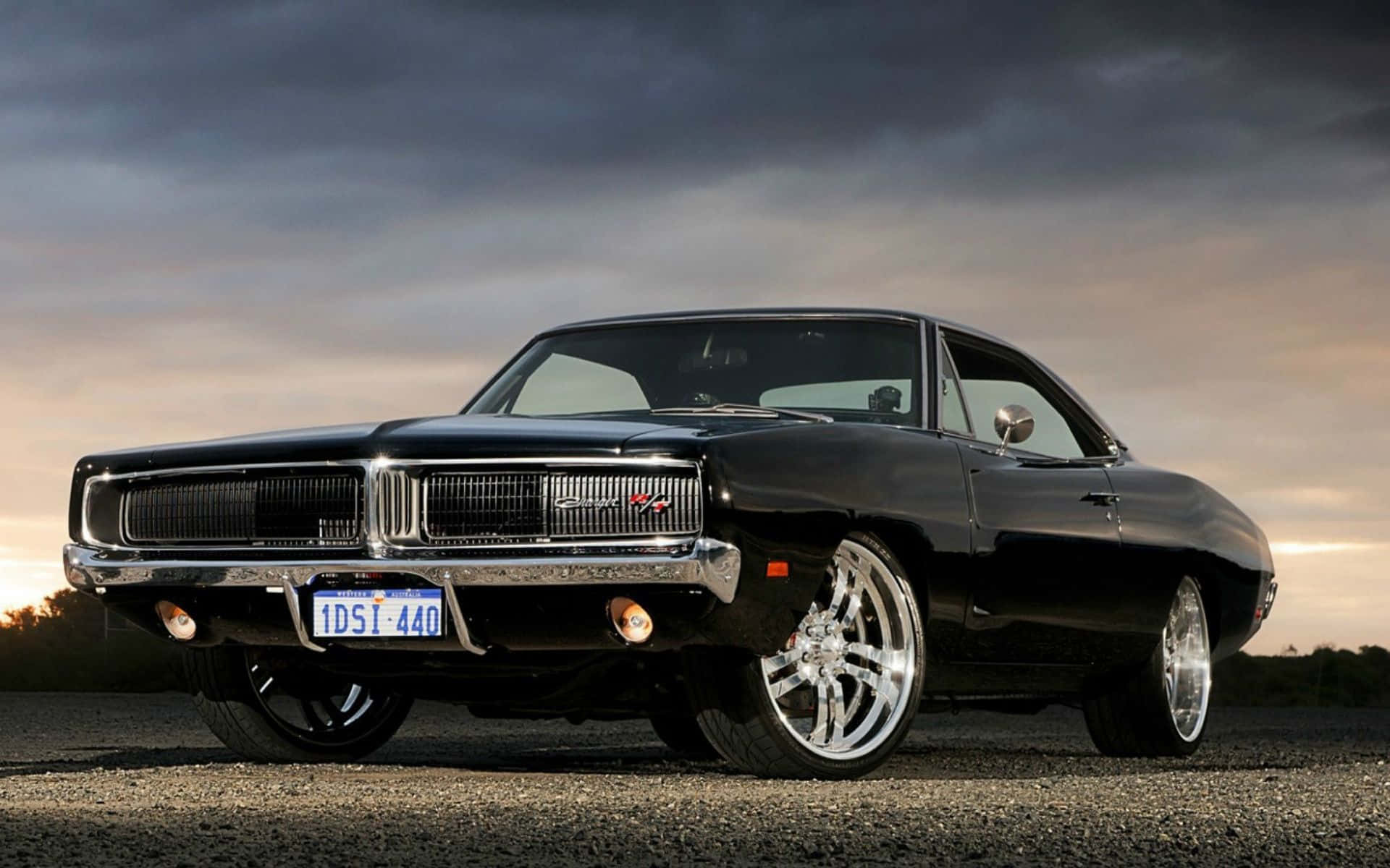 A Stunning Dodge Charger On The Road Background