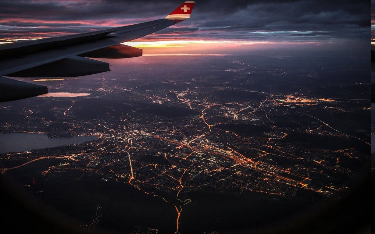 A Stunning Night Sight From A Plane Window Background