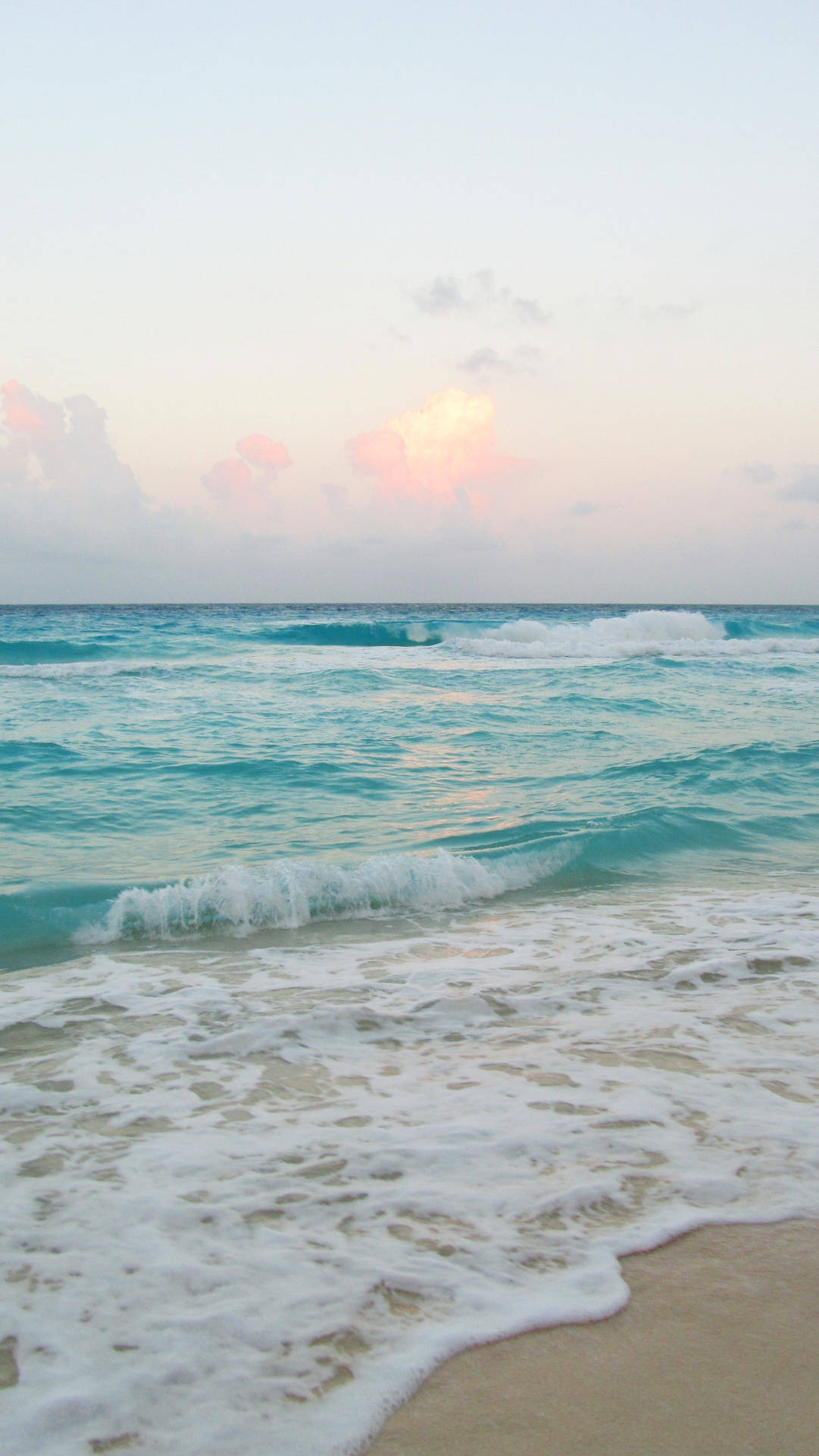 A Stunning Ocean Wave Overlooking A Beautiful Beach. Background
