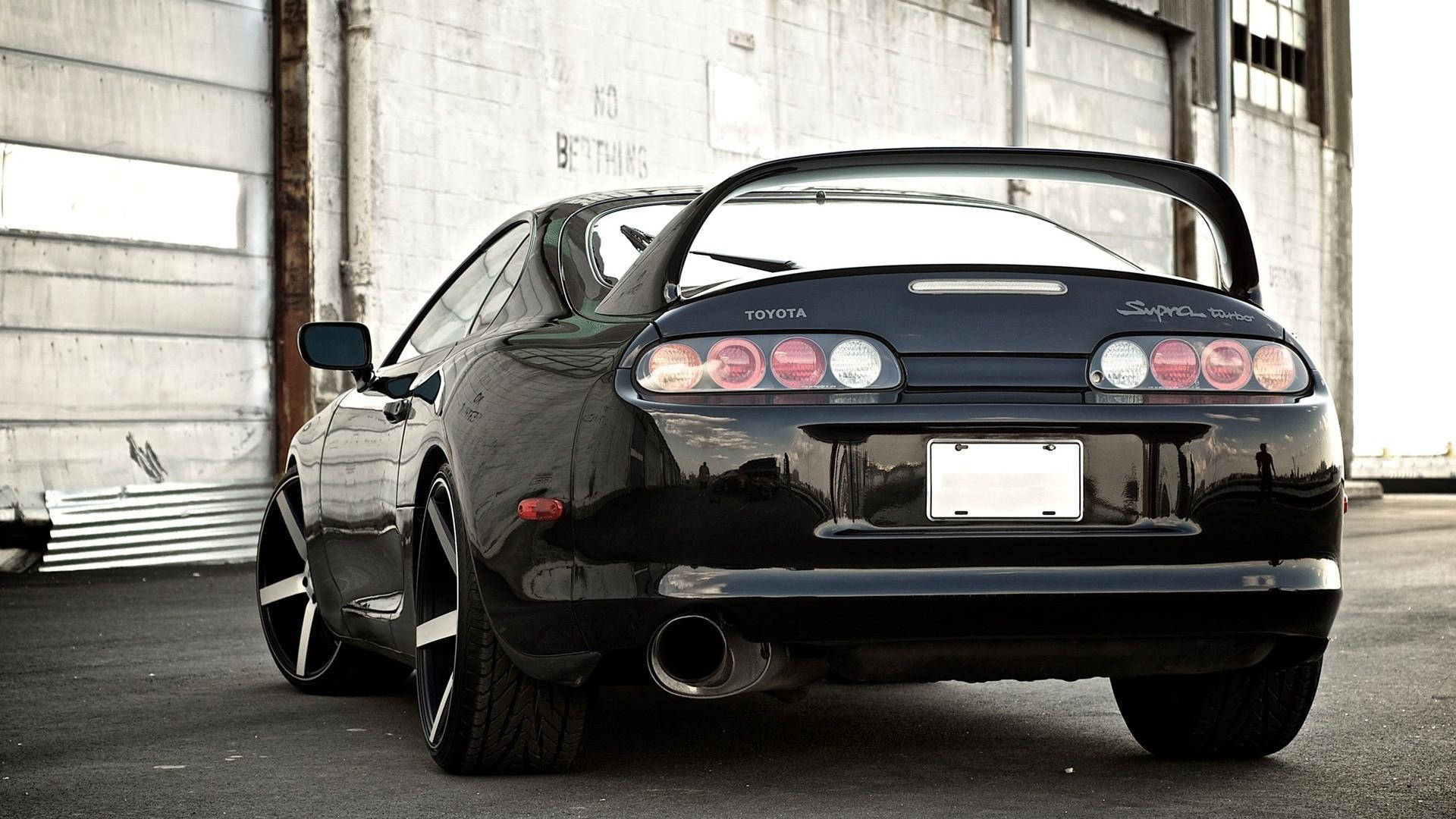 A Stunning Rear View Of The Black 1994 Toyota Supra Mk4